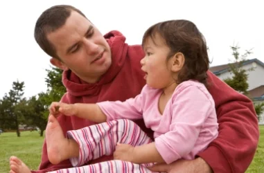 Dad talking with 12 month old baby; speech development at Canto Speech Therapy Online