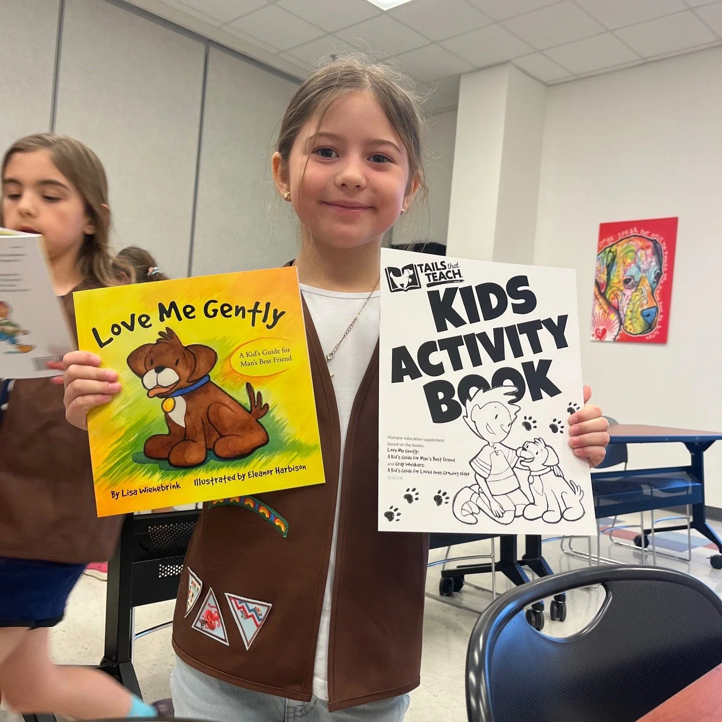 Girl Scouts helping out at their local shelter's Reading Buddies Program @pvastxold #humaneeducation #booksforkids #girlscouts #literacy #doglover #puppy #tailsthatteach