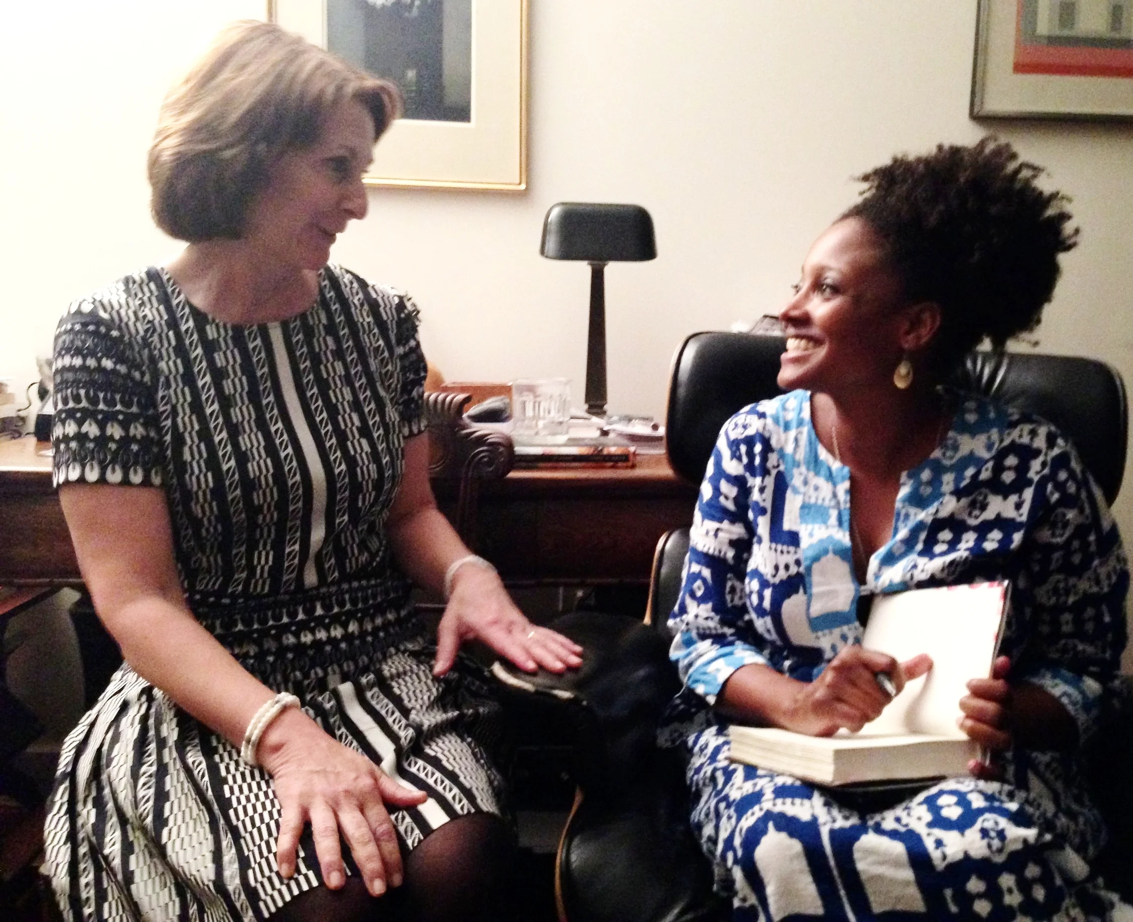 Poet Laureate Tracy K. Smith signs a copy of her memoir, ORDINARY LIGHT