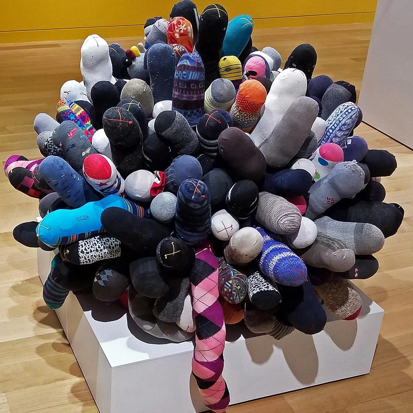 We love the humor of ordinary objects transformed in this piece from Lisa Barthelson&rsquo;s Family Debris Series. &ldquo;life&rsquo;s a ball, sock it to me&rdquo;, family debris: cast off, accumulated, and recycled family socks, polyester fiber fill