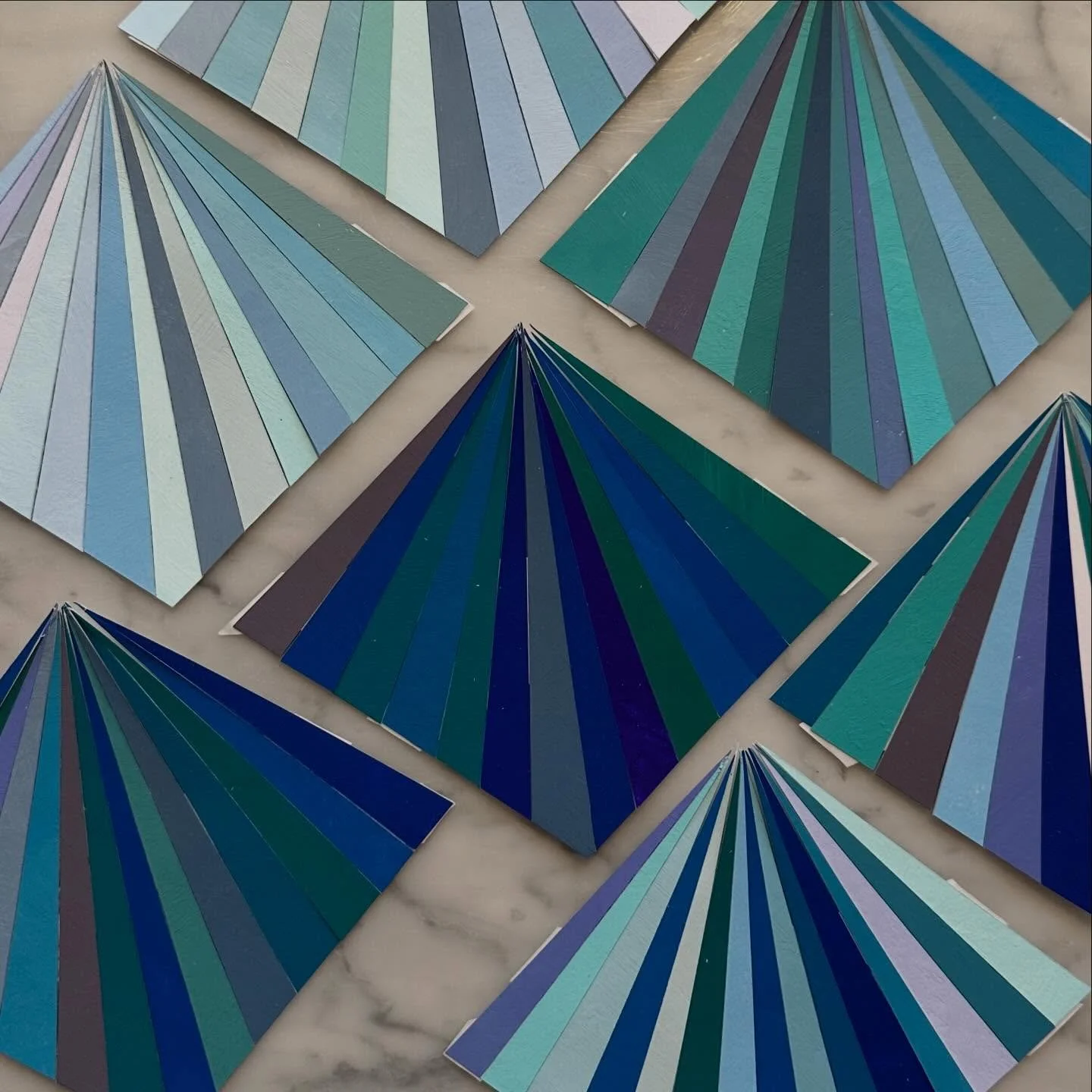 Collage prep. Last week I painted a bunch of color swatches and brought them home in anticipation of a snow day. Yesterday I cut diamond shapes from each color. Today I took things a little further. Tomorrow I hope to be back in the studio!

#snowday