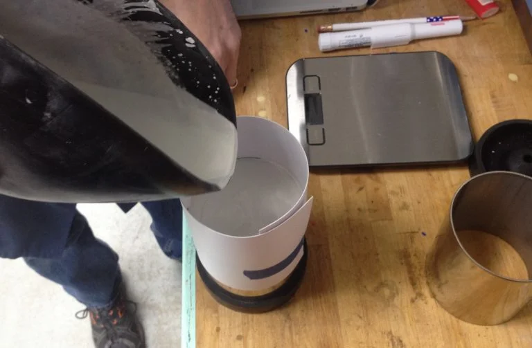 Pouring investment to cover the wax model.