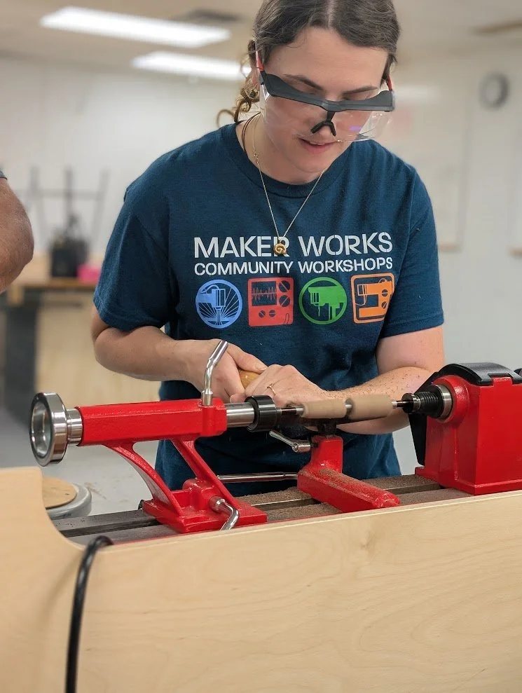 Photo of artist actively at work on a Pen Lathe