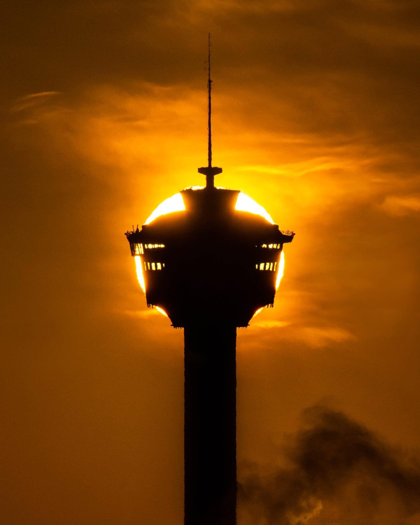 Rise &amp; Shine!

This year&rsquo;s edition of the Calgary Tower Eclipse, taken this morning. 

The sun is so bright(!) believe it or not, so last year I took a piece of arc welding glass out with my to protect my eyes. This year, after having switc