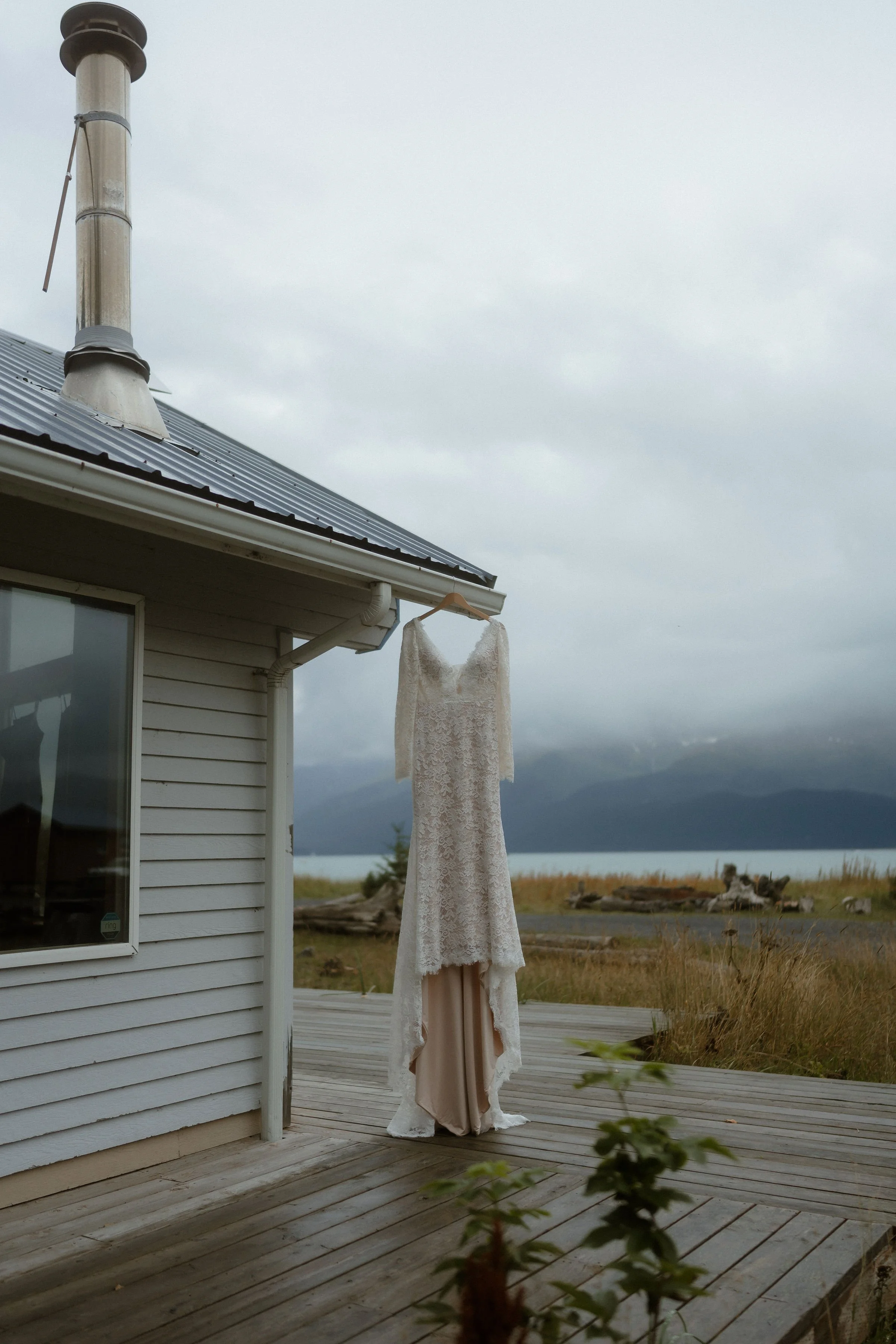 Madelynnmae-brides-dress-and-cabin-by-the-sea-Seward-Alaska.jpg