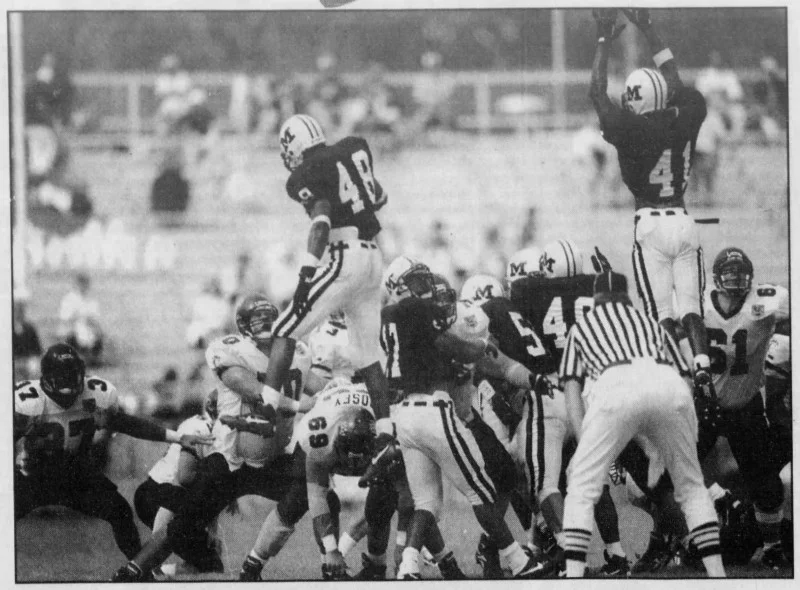 Miami fails to block a 58-yard field goal from Jon Bacon. (Enquirer/Gary Landers)