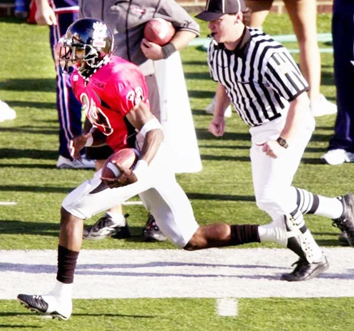 Zach Norton runs back an interception for a touchdown. (Jeff Swinger)