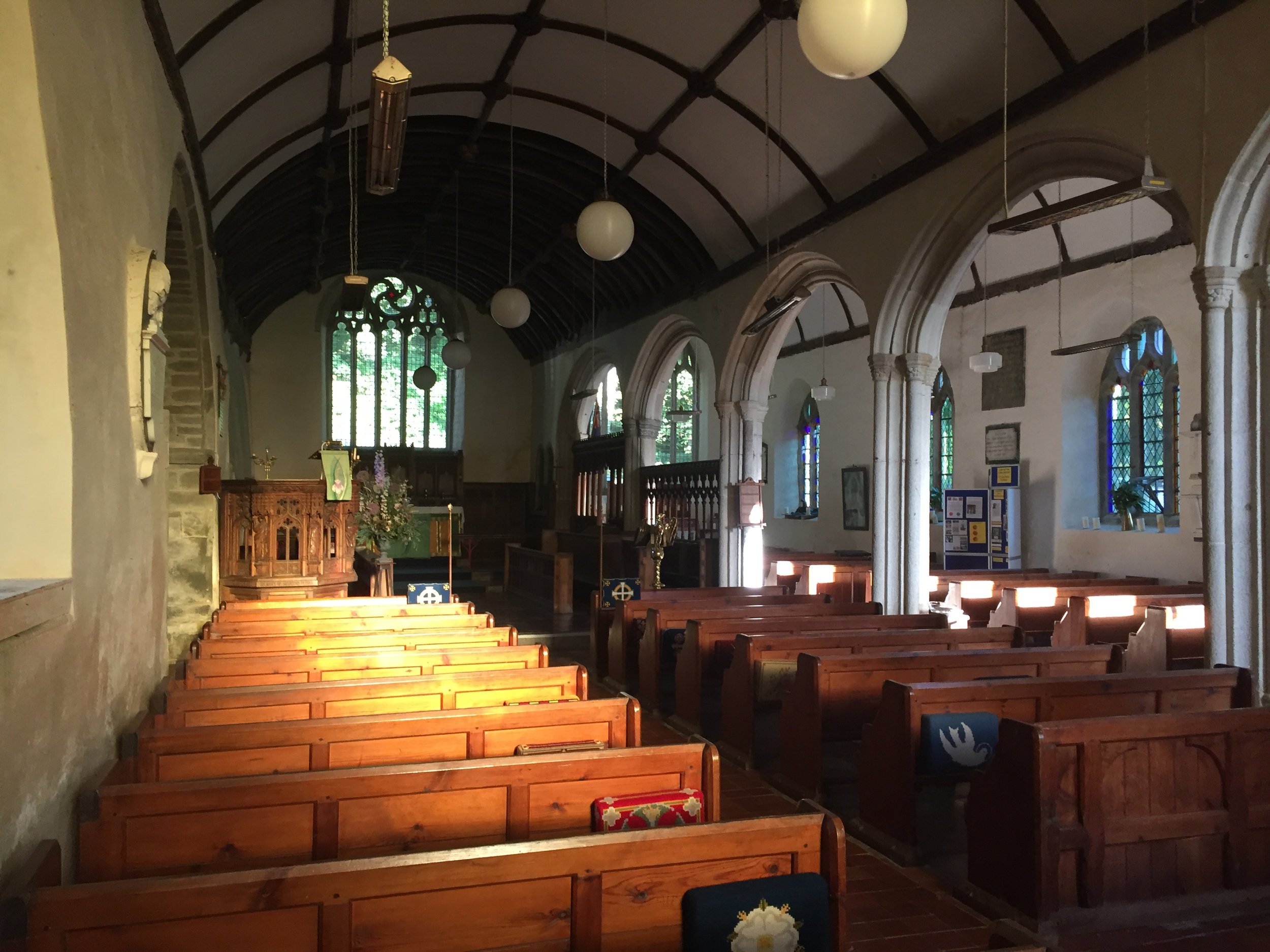 Interior. Note unusual filigree in east window.JPG