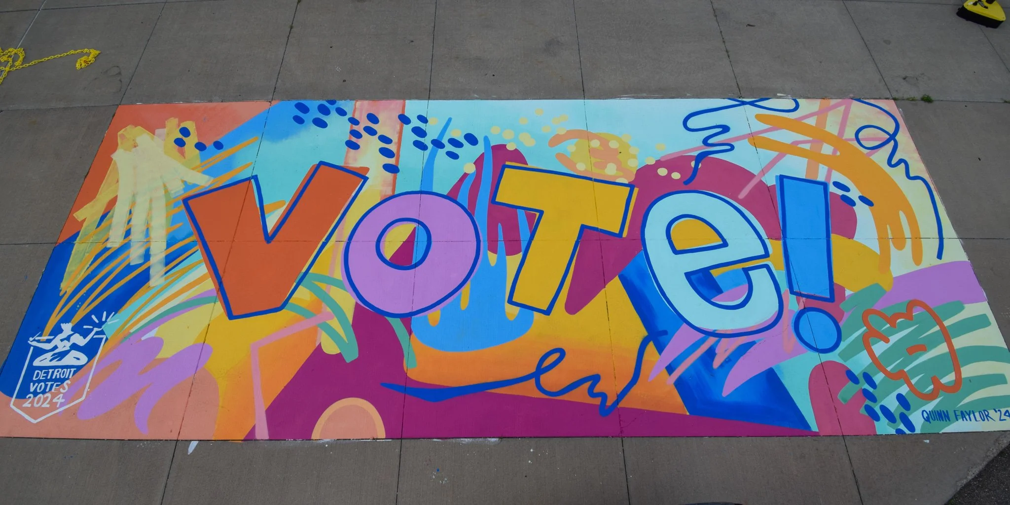  Mural painted on the sidewalk outside of Kemeny Recreation Center in Detroit, MI as part of the "Detroit Votes Early – Feet in the Street" campaign. Painted in the fall of 2024. 