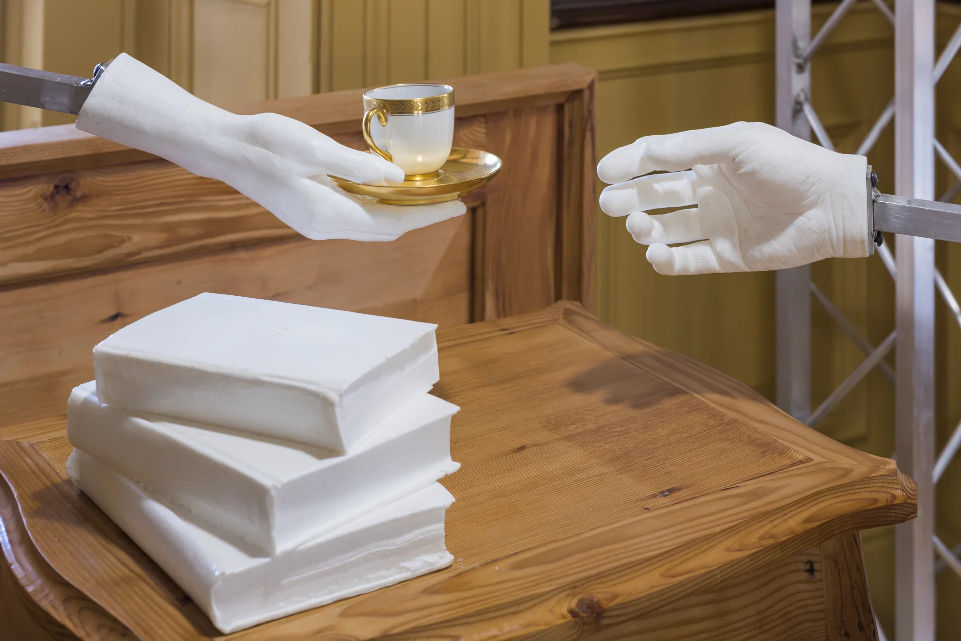 Detail of An Evening , showing cast-urethane hands and teacup from Glen Foerd's collection. 
