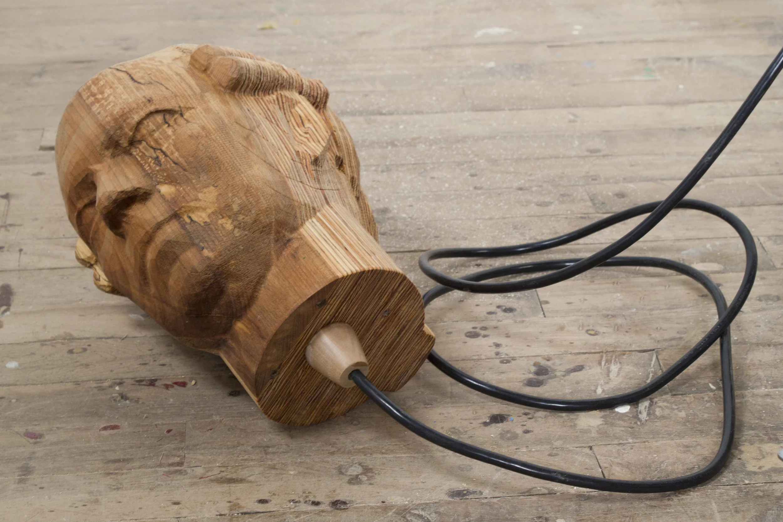A Story Told Too Many Times . Detail of CNC-carved head. 