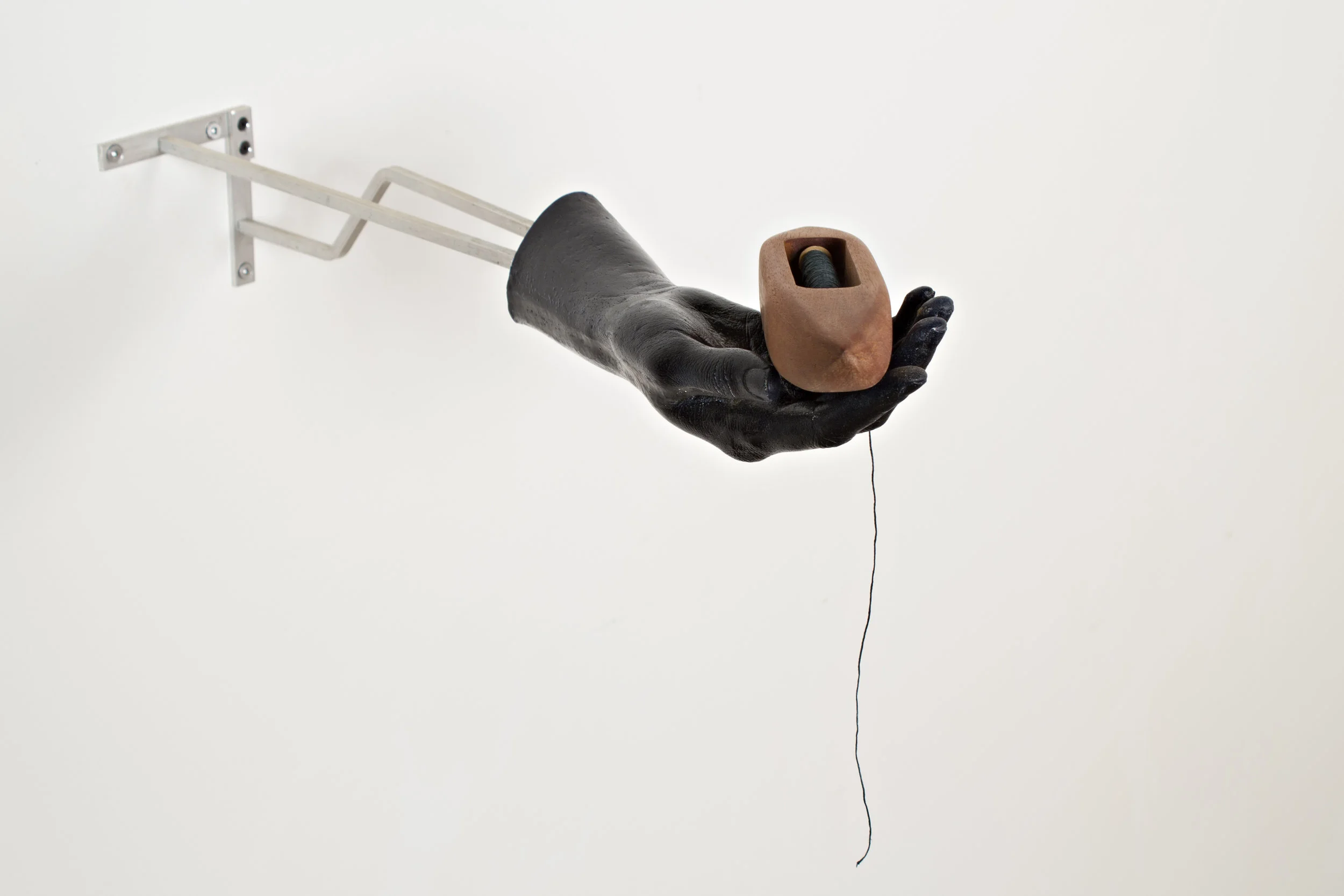 The Weaver, 2015. Cast urethane, mahogany, poplar, silk, brass and aluminum. 8” x 8” x 20”