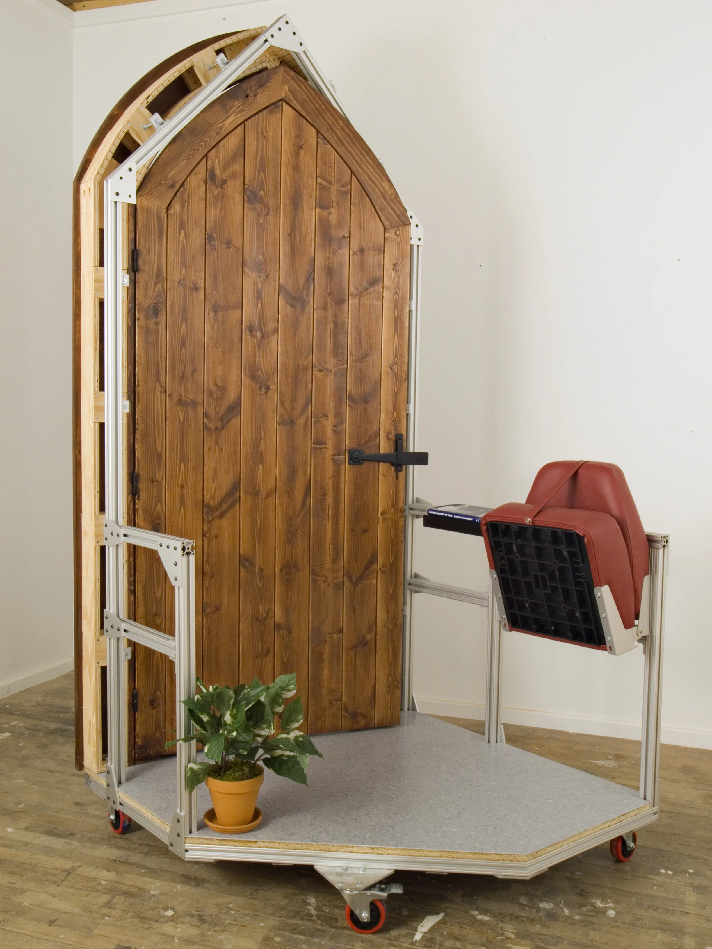 After the Artifact (Waiting Machine) 2010. Pine, aluminum extrusion, copy of Stephen Hawking’s A Brief History of Time, and mixed media. 98” x 45” x 48”