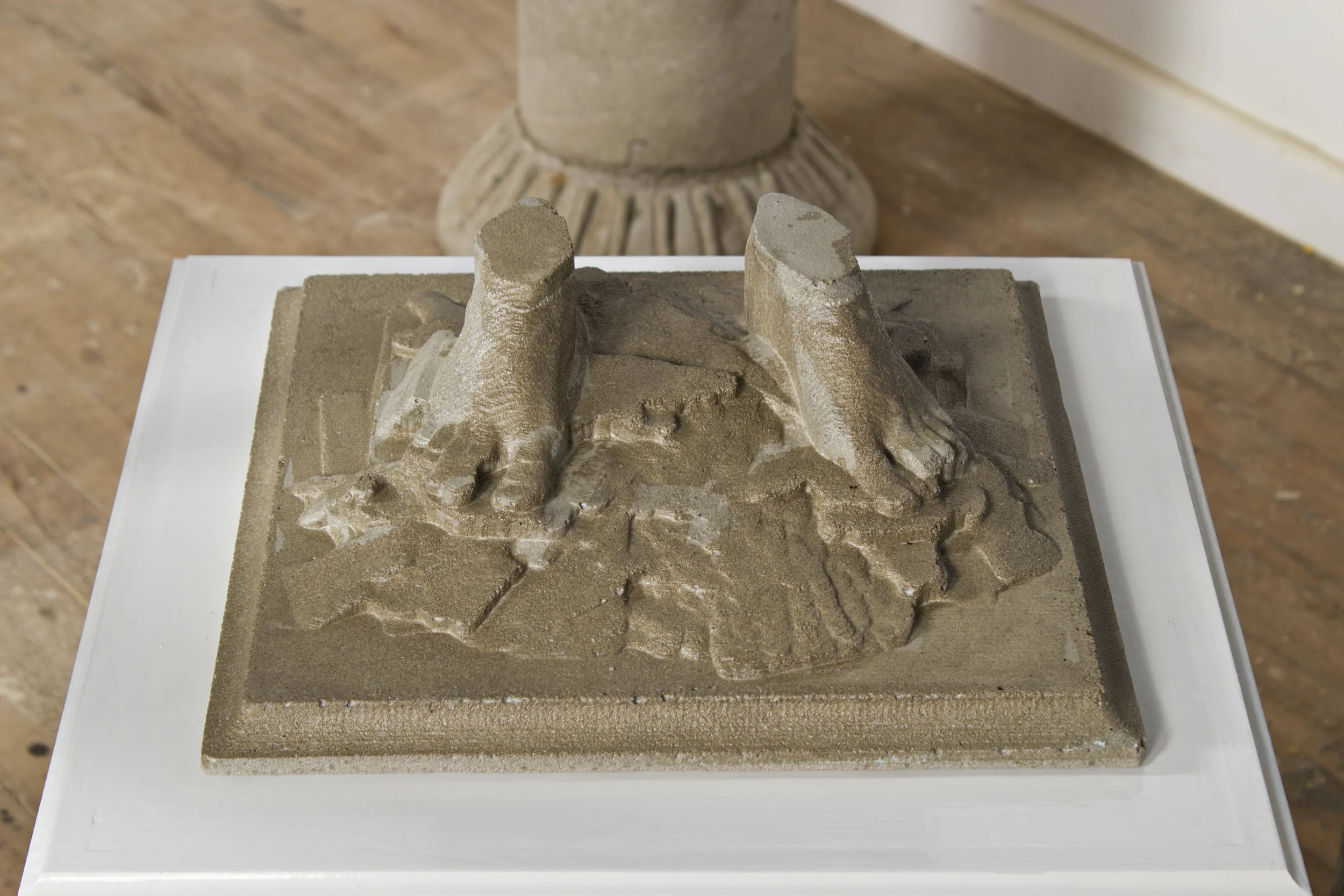 Two Monuments , detail of cast-concrete feet.