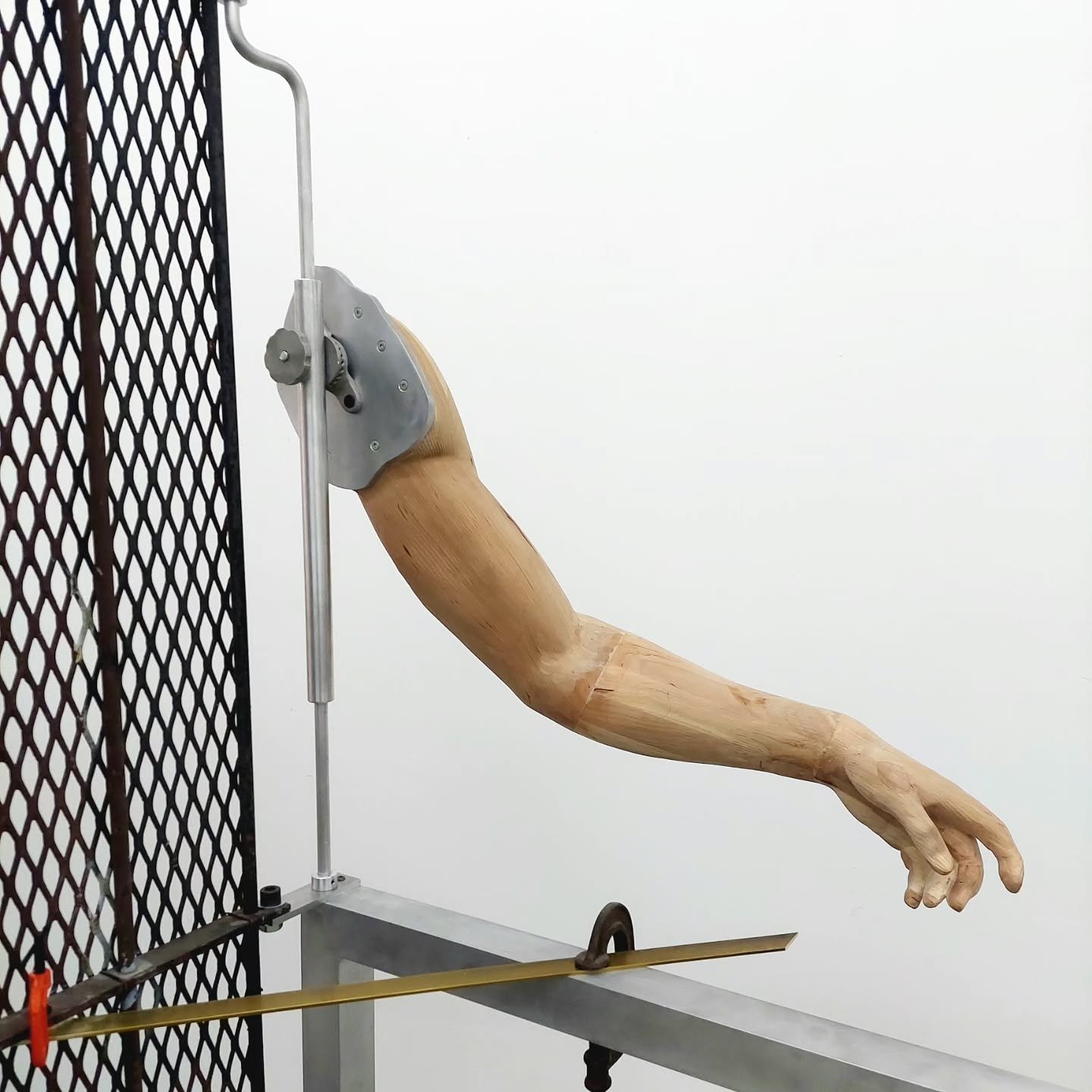New guy coming together. Getting the arm attached feels like progress. The mount comes from an old chalkboard, it lets the shoulder lock into a variety of positions. The grate stood between the studio building and the next door house until the house'