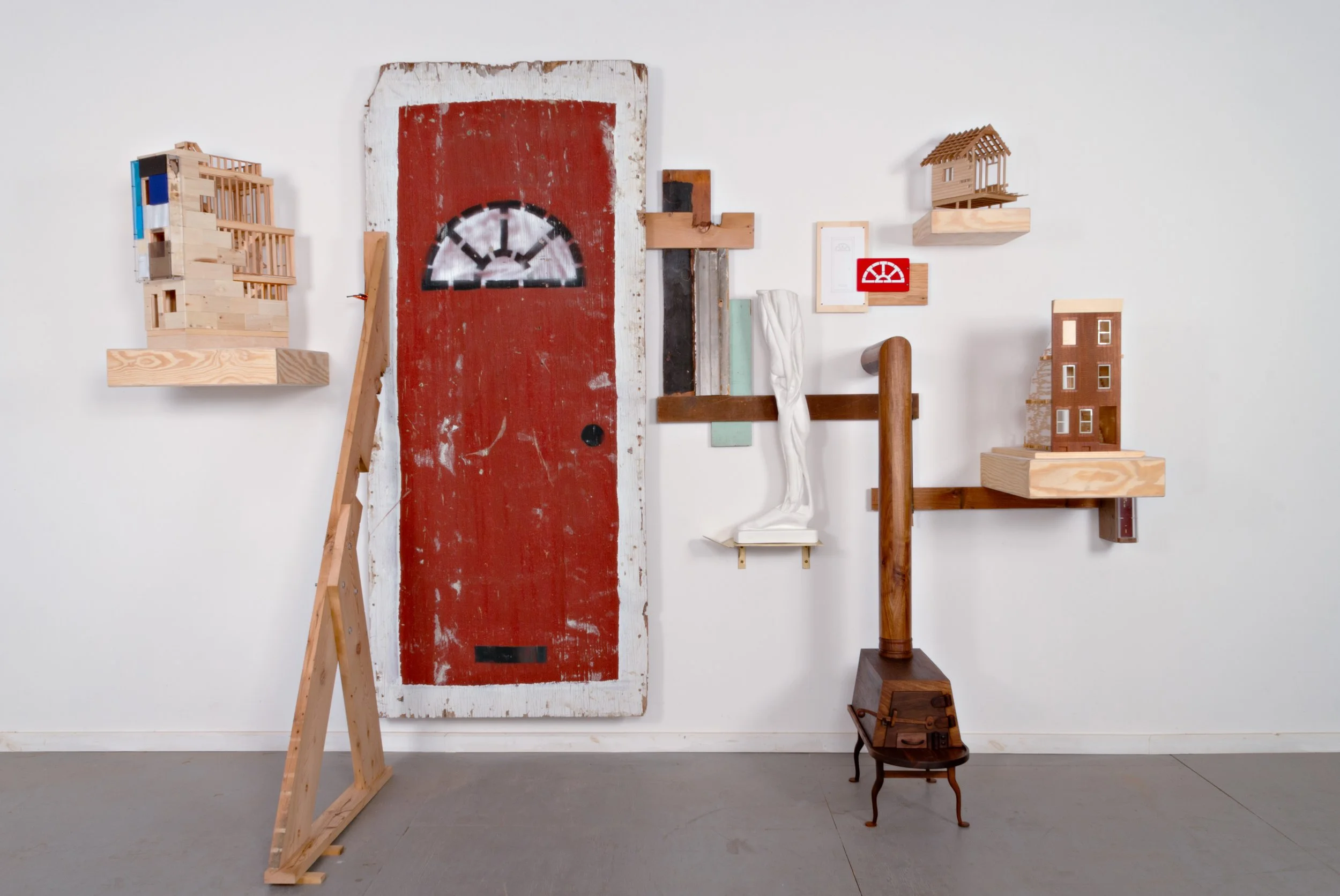   Essays for an Architectural Love Letter (After Christopher Alexander),      2012-2026.  92” x 128” x 45”  Walnut, fir, oak, cherry, pine, jatoba, plywood, acrylic, paper, enamel, copper pipe, plywood door painted by the City of Philadelphia, C-clam