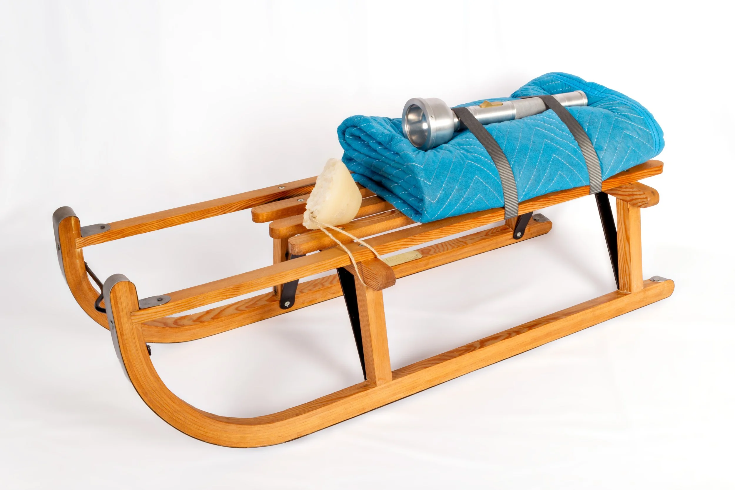   Untitled Rescue Device (After Beuys),      2025  14” x 35” x 14”   Salvaged pine, steel, aluminum, brass, acrylic, wax, linen, packing blanket and nylon straps.&nbsp;  Copy of Schlitten (Sled) a multiple by Joseph Beuys. 