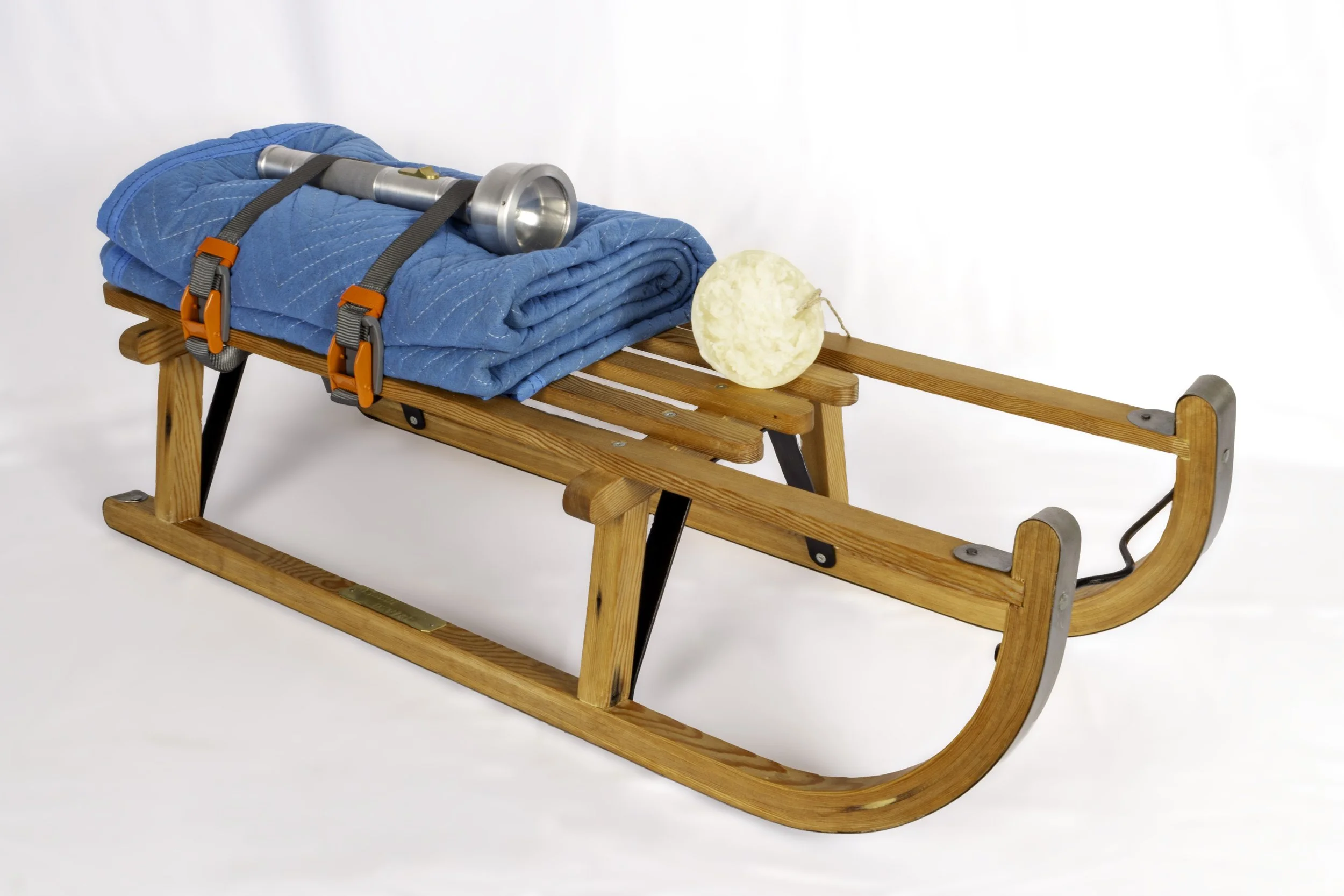   Untitled Rescue Device (After Beuys),      2025  14” x 35” x 14”   Salvaged pine, steel, aluminum, brass, acrylic, wax, linen, packing blanket and nylon straps.&nbsp;  Copy of Schlitten (Sled) a multiple by Joseph Beuys. 