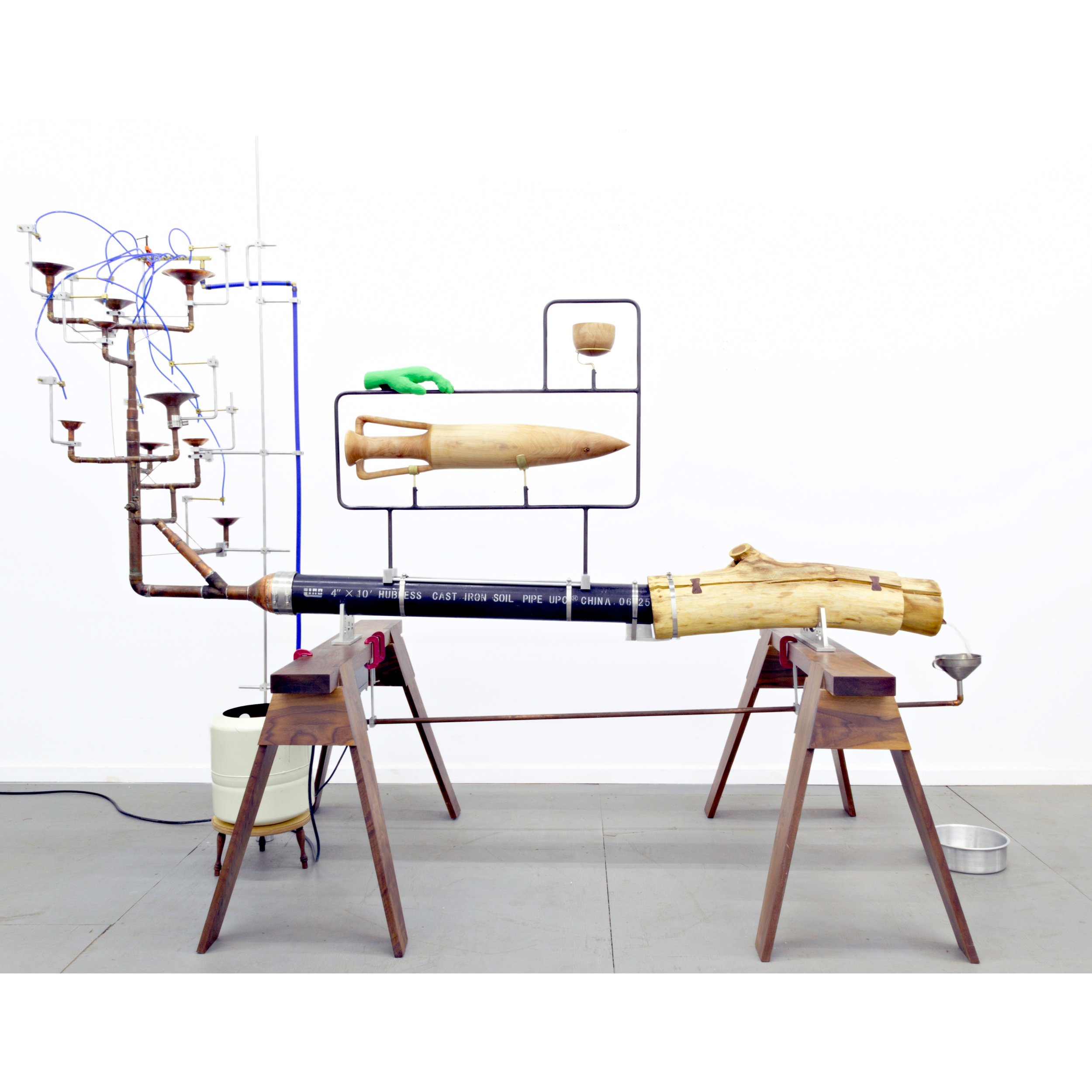   Provisional System IV (A Very Human Impulse) , 2024  84” x 103” x 42”  Walnut, birch, basswood, honey locust, plywood, aluminum, copper, brass, steel, cast iron drainpipe, expansion cell tank, funnel, Chroma-Key paint, C-clamps, graphite, water pum
