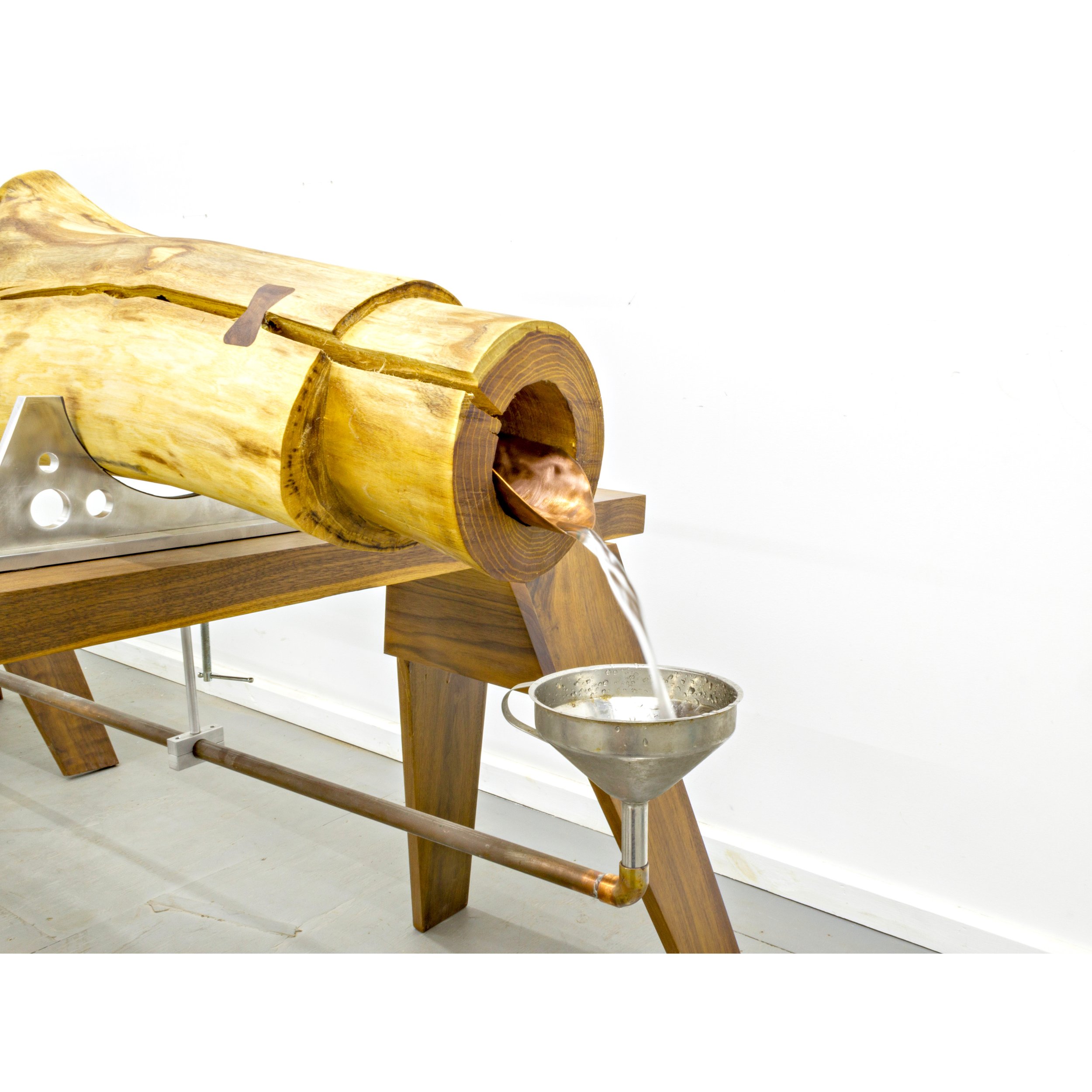   Provisional System IV (A Very Human Impulse) , 2024.  Detail of hollowed log pipe. Before cast iron, Philadelphia used hollowed logs as water mains; the last wooden water pipes were taken out of service in 1858. Hollow logs are still buried in the 