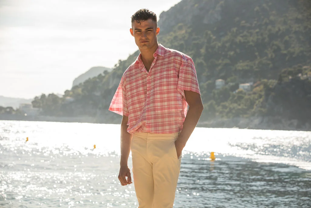 Harry wears E Tautz shirt & Orlebar Brown trousers