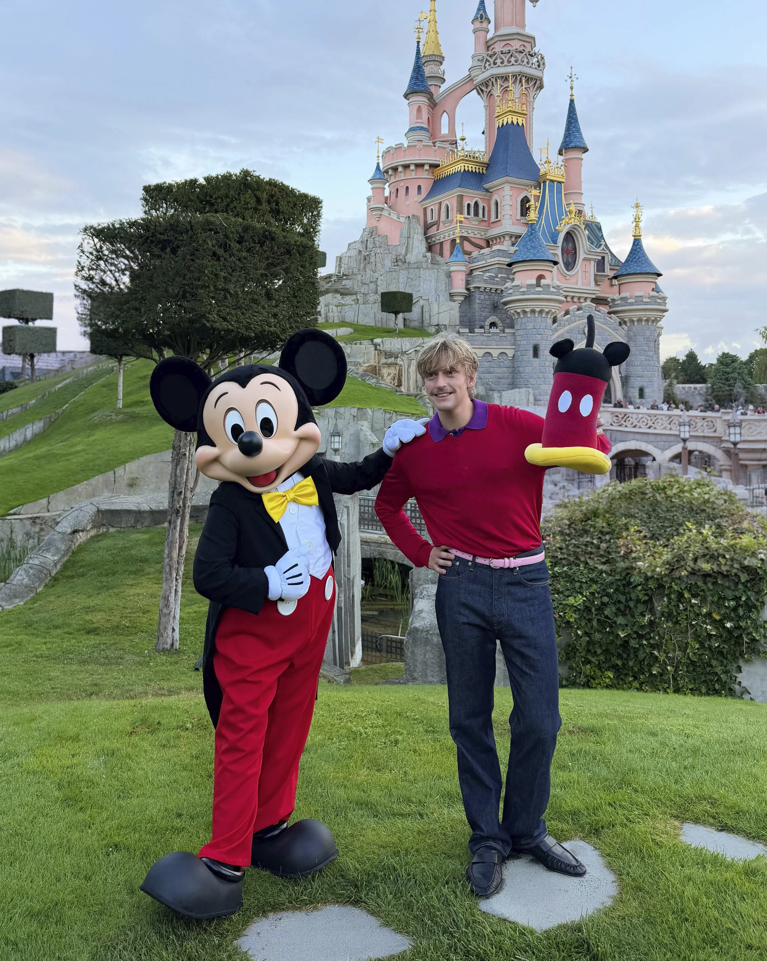 Gustaf Westman at Disneyland Paris with Mickey Tumbler.jpg