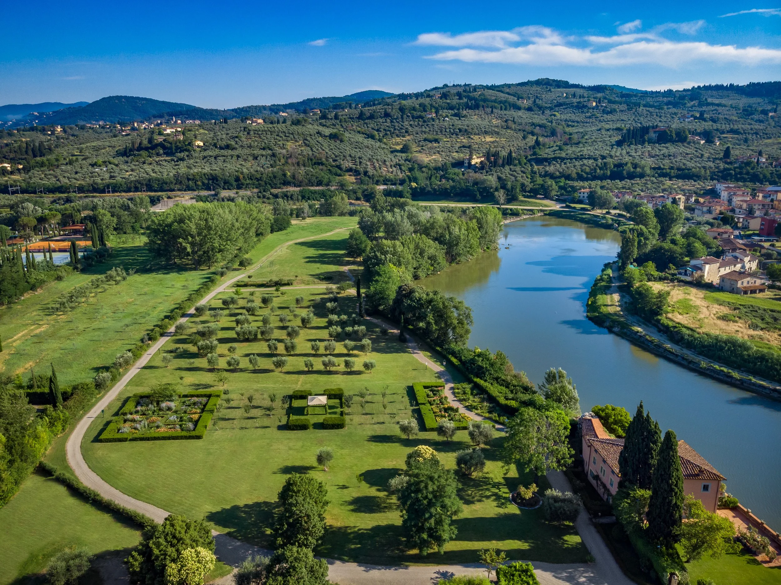 Villa La Massa - Garden of Villa La Massa and the Arno River.jpg