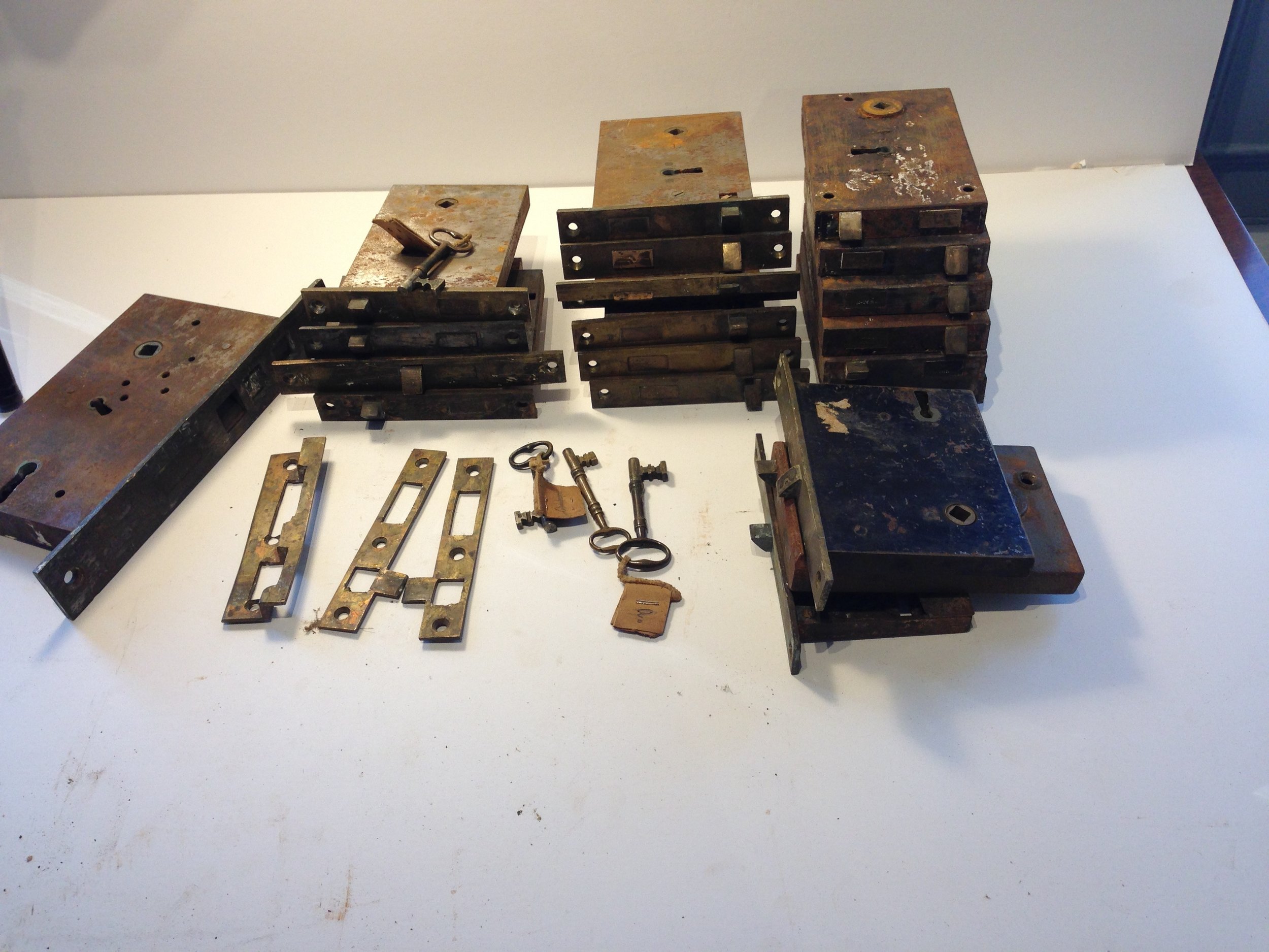 Collection of locks probably salvaged from one house.  Many of exposed faces on the mortised locks are silver as determined by X-ray fluorescence