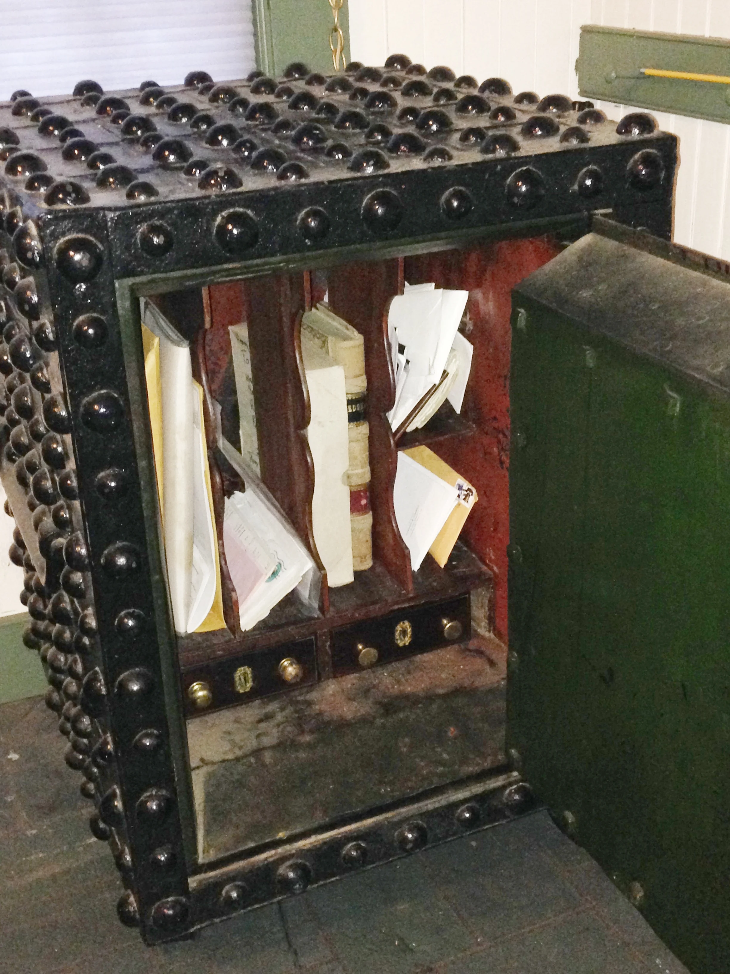 The safe interior is fine furniture, pine with figured mahogany veneer.