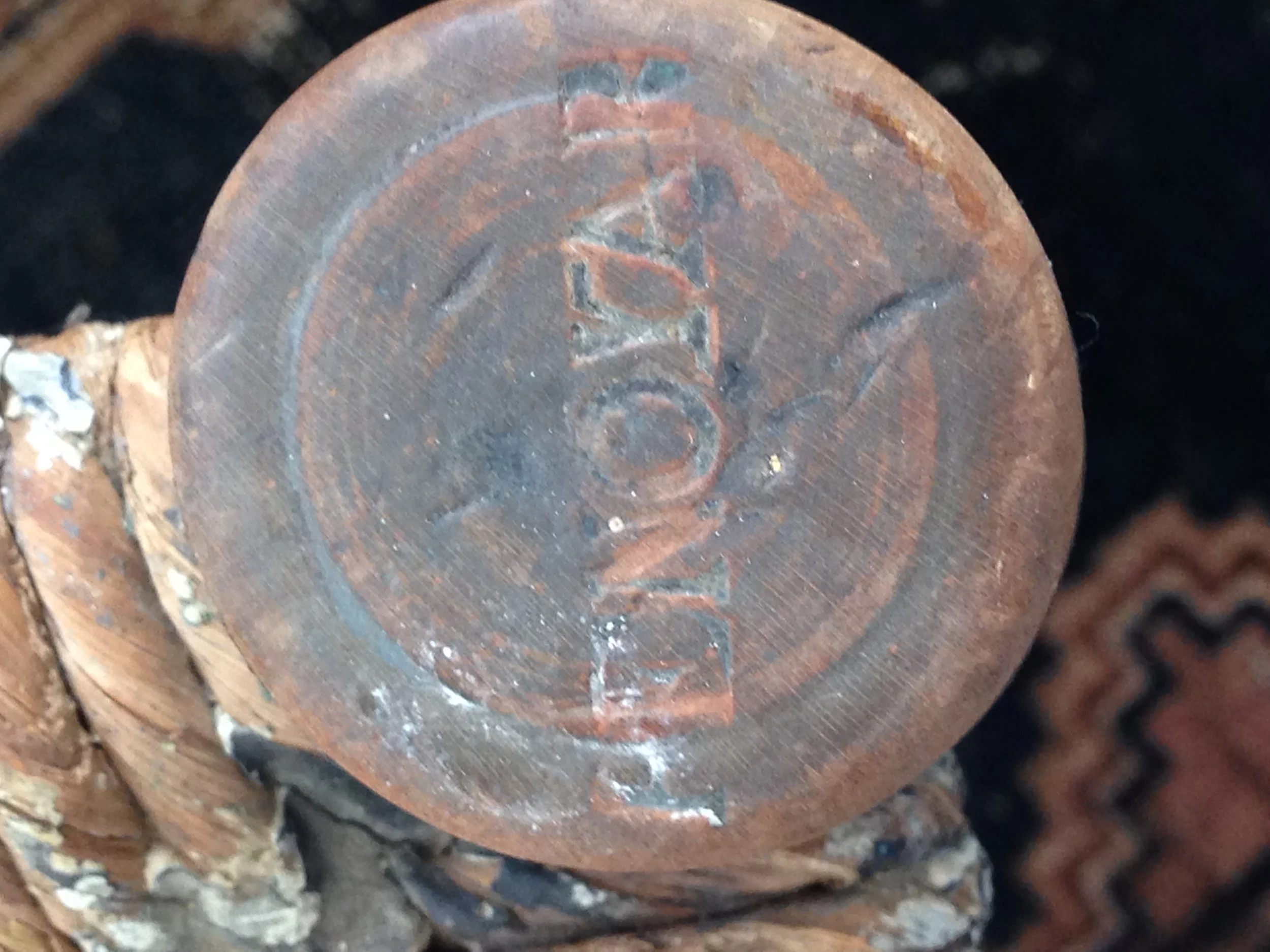 "Penoyar" stamped on top of front leg