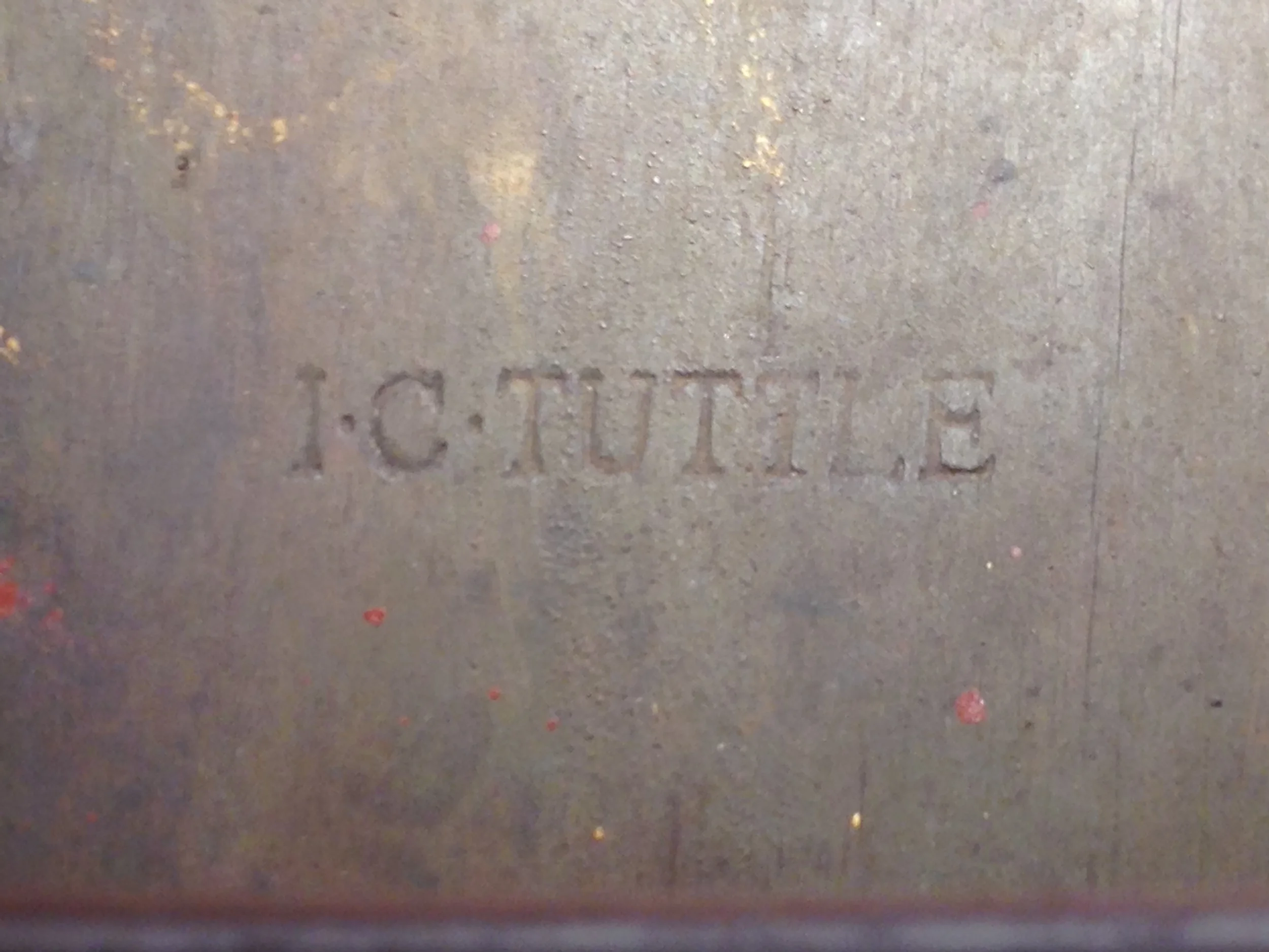 "I. C. Tuttle" stamped on bottom of seat