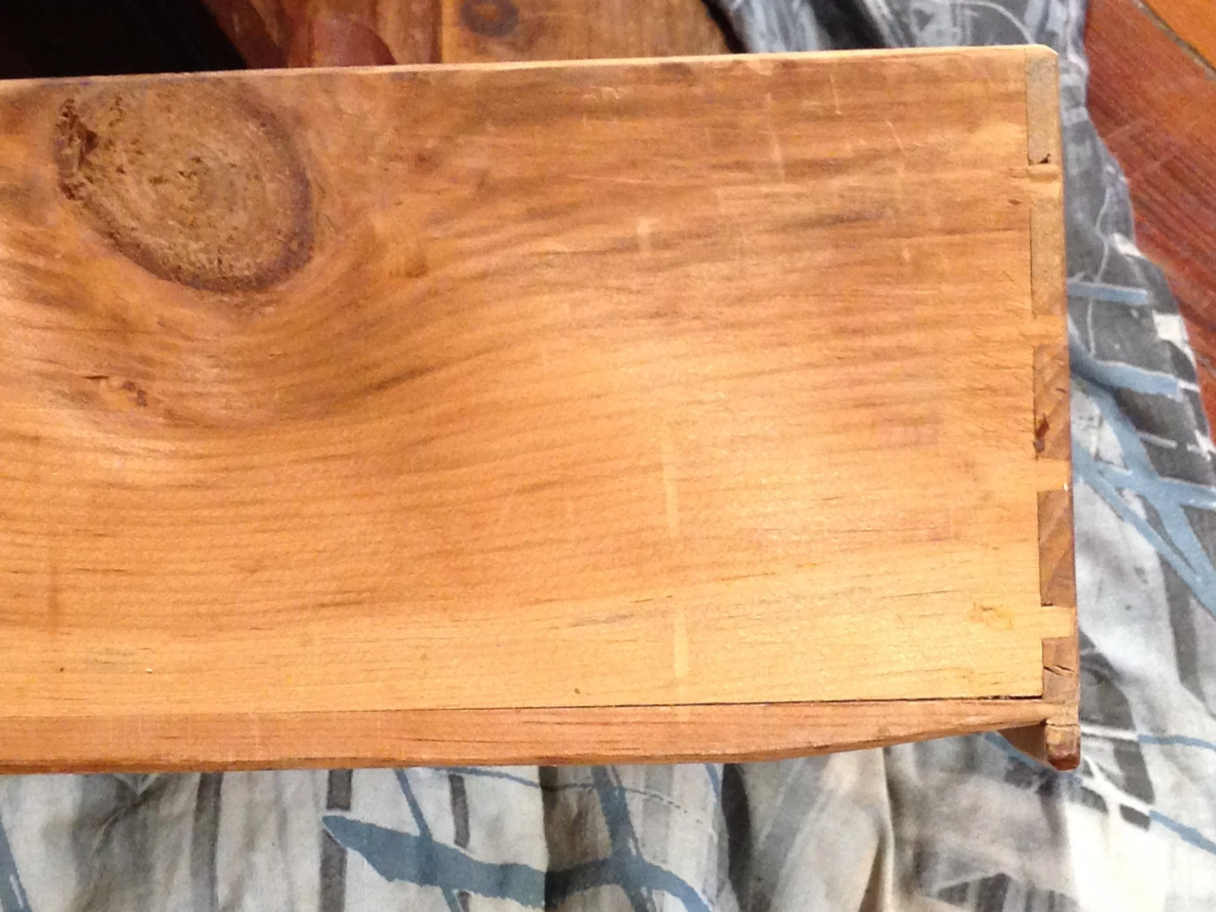 Drawer back showing method of installing drawer bottom