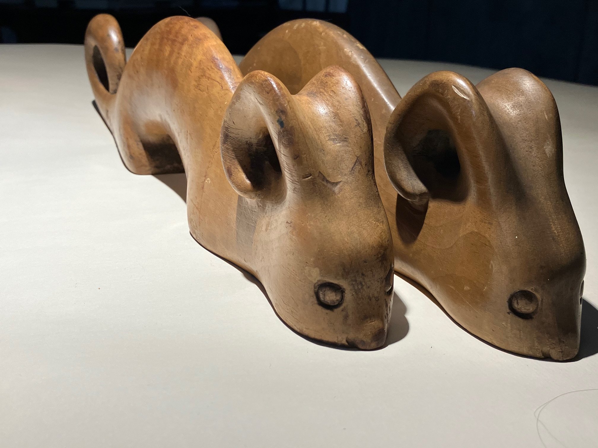 A closeup of the carved wooden creatures