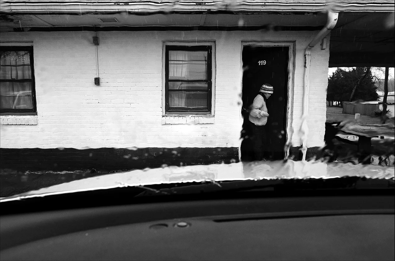March 2017: Vickie stands in the doorway of the motel she and Clarence lived in for a month. After finding bed bug bites on his scalp and body, Clarence asked for another room. Clarence said the manager then told them to leave at the end of the month. “I’m itching all night and I’m paying $500 a month," Clarence said.