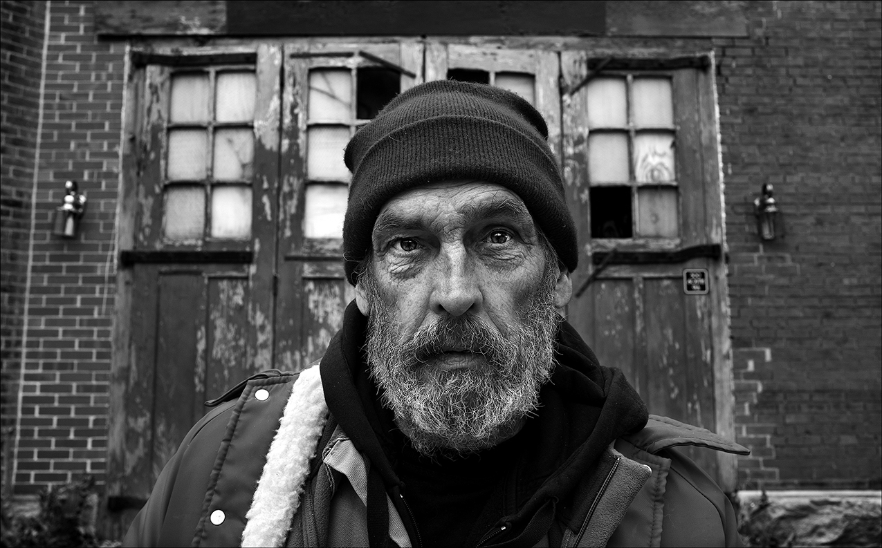 February 2017: David says he’s stuck out in the middle of nowhere. "Other people get help that they need, and that's a good thing. But I do know that there are some who fall through the cracks of the red tape of bureaucracy. ... It's like nothing applies to them. Then it all just goes to, in my mind, to survival." “It's really kind of saddening for me because a lot of places and stuff, 'Oh yeah, we're gonna help, we're gonna help,' and they do to a point, and then it just ... That's the end of it. What is to come along after that to help, to be beneficial? I feel that I run into a brick wall, a roadblock. And another one, and another one and another one. And it shouldn't be like that. It really shouldn't.” David sleeps outdoors often when he can’t arrange to stay with friends. David recently had cataract surgery, but his vision remains blurred because he can’t afford glasses, and Medicaid will only pay for glasses every two years. He must wait until December 2018 to qualify. David says he once stayed at the Fishers of Men shelter in Quincy, but a manager there asked him to flush his prescribed pain pills down the toilet so the manager wouldn’t be tempted to steal and use the pills himself. David then decided it was time to leave. “I became homeless three years ago. Medical problems, financial problems, poor relationships and loss of jobs -- a chain of events -- made it to where the only alternative I have is shelters, missions and camping out,” he said. David says things happen to him that he can’t always foresee or prepare for. “There’s probably a lot of people who face things beyond their control. People end up in situations like mine. It becomes a circle of survival. You gotta stay warm, you gotta stay clean, you gotta eat,” David says. “I find that even when I wasn't in this situation that I took a lot of these things for granted because it's just an everyday thing and that's what, you know, I was there. To turn around and have the world upside down, it's not all there. So you have to obligate your time to these things. I find that I don't really think a lot of people understand the roughness of these things gone … just simple little things, gone. You have to improvise and trade this thing for that to take care of things.” David said doctors have told him he has bipolar chronic depression and have labeled him a "chronic homeless.” “I have some anger issues, some other things that are happening that I really don't understand,” he said. “I’ve got vision problems. Got back and neck problems from an accident. Depression. I get depressed. Anxiety level. I don't wanna be around anybody. I don't like being closed in and indoors, small spaces. I have a real problem with medications. A psychiatrist might want to prescribe you a medication that has odd side effects, only in a certain percentage of test subjects. That scares me because if I have another medical problem with another doctor, and I'm not supposed to take that kind of medication, then there's a problem. More stress, more anxiety. Then after the doctors and the prescriptions and everything, then I find that there's times you can't afford it, even with your copays and that type of thing.” David says obtaining housing is pretty difficult. “Most everything is privately owned or state or city property,” he said. “You gotta be real careful. You don't wanna be camping out on somebody’s property without permission. That's go to jail, criminal trespassing. You’ll end up in court, fines, jail time. I had to be real selective of where I camp out because I don't want a whole lot of traffic in the middle of the night. Safety. Place that's dry. Wintertime. Dry, snow, rain. A lot of these things are real detrimental. You gotta have certain amounts of equipment, blankets, that type of thing. Stay warm, stay dry. “Last time I heard statistically, there's about 1,800 hypothermia-related deaths in the United States a year. You have to be pretty much aware, pretty much survival conscious, to be able just to deal with the elements. Not even worrying about the human element that may be lurking around out there. Bigger the city, more dangerous it is. Of course any town or city's dangerous. You never know what another individual might have going through their mind or what they wanna do.” David has tried staying at the Salvation Army. “There’s the possibility, this time of year in the winter months and bad weather, they stay pretty full,” he said. “I don't really think that they have enough accommodations for the amount of people who actually are out there living through this.” David is confident things will get better. “At least I'm gonna try my best to make that happen for me,” he said. “I'd like to see more people become aware and not have a blind eye against an epidemic that we've had in this country for years. People being broke, poor, in poverty. On the streets. Begging for handouts. Just trying to survive. “It's something that's not going away. A lot of people say, "Well, we gotta help, we gotta help. Let's put a Band-Aid on it.” Hey, maybe it's time that people looked around, opened their eyes. Instead of putting a Band-Aid on a broken arm, let's put it in a cast and fix it. This is America. There shouldn't be 1,800 people dying in this country from hypothermia in the wintertime because they're living out on the streets. Sixty-four percent of them are men. This is America. I mean, it shouldn't be this way.”
