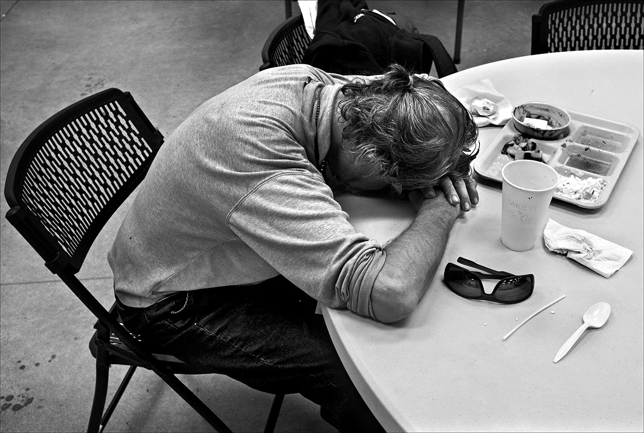 April 2017: After a sleepless night, James rests his head on a table at the Horizons Soup Kitchen. “You have to accept the fact, damn. The more you resist knowing the fact that you’re homeless, the worse it can be for you mentally and emotionally.”