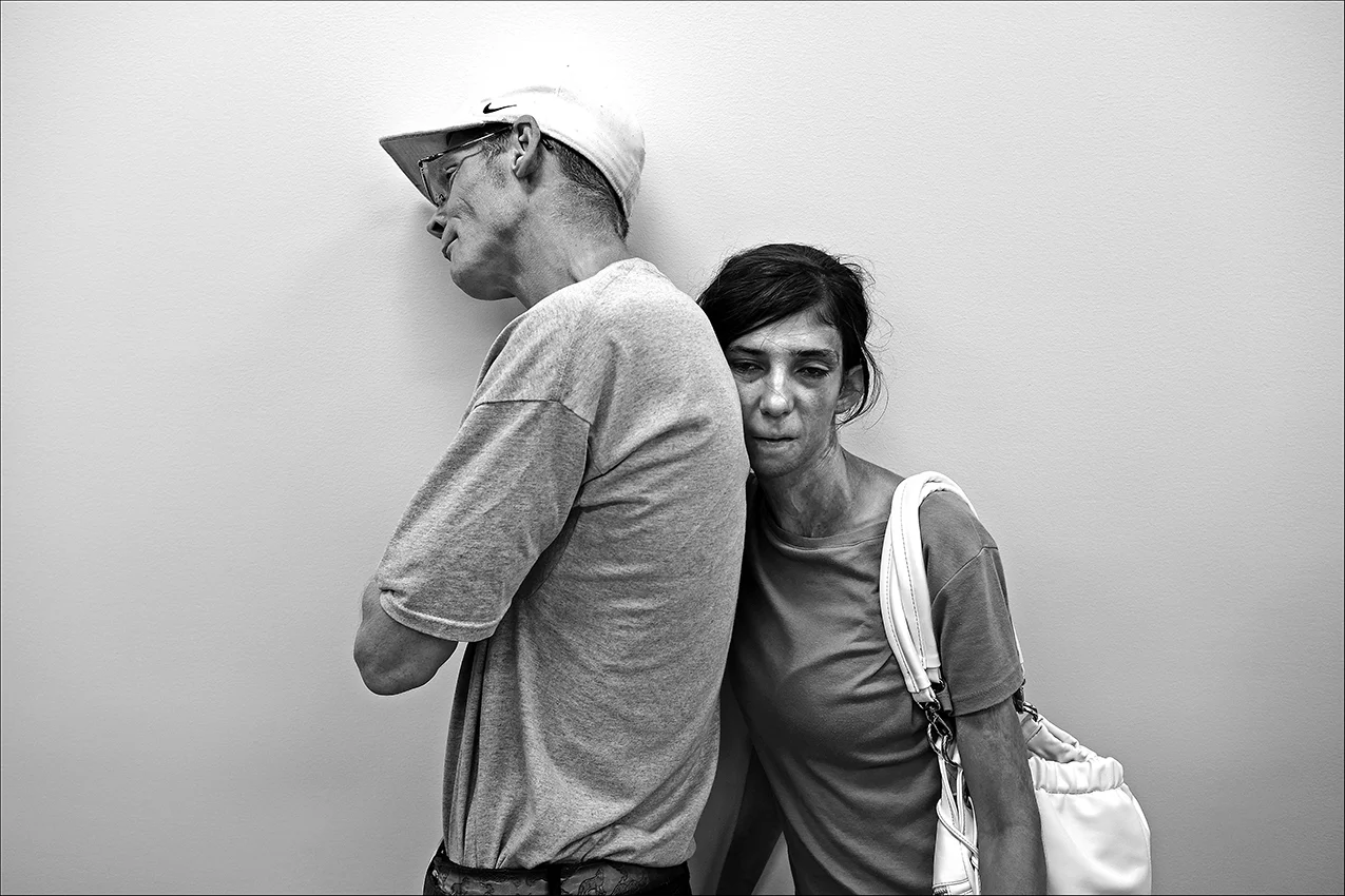 August 2016: Tired, with blisters on his feet from walking all over town, James and a girlfriend wait in line at the Horizons Soup Kitchen for a hot meal. James says all he has to do is clean and cook to stay with her. After about a week, the relationship ended and James was back out on the street.
