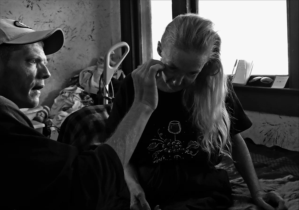 July 2016: James applies medicine to a wound on the face of a friend. James says he likes helping people. “Just buying things from certain people that need money is another way I help them out. Even though I don't have much I still do it to, just to help them out so they can get what they need. But it's making it harder on me cause I'm not watching what I'm doing and getting more careless with it and putting more people before myself. A friend of mine that has a three-year-old daughter needed help with the electric bill, so I took $50 out of my check and a $40 winning lottery ticket and gave it to her to help feed and keep the electricity on for that little girl,” James said.