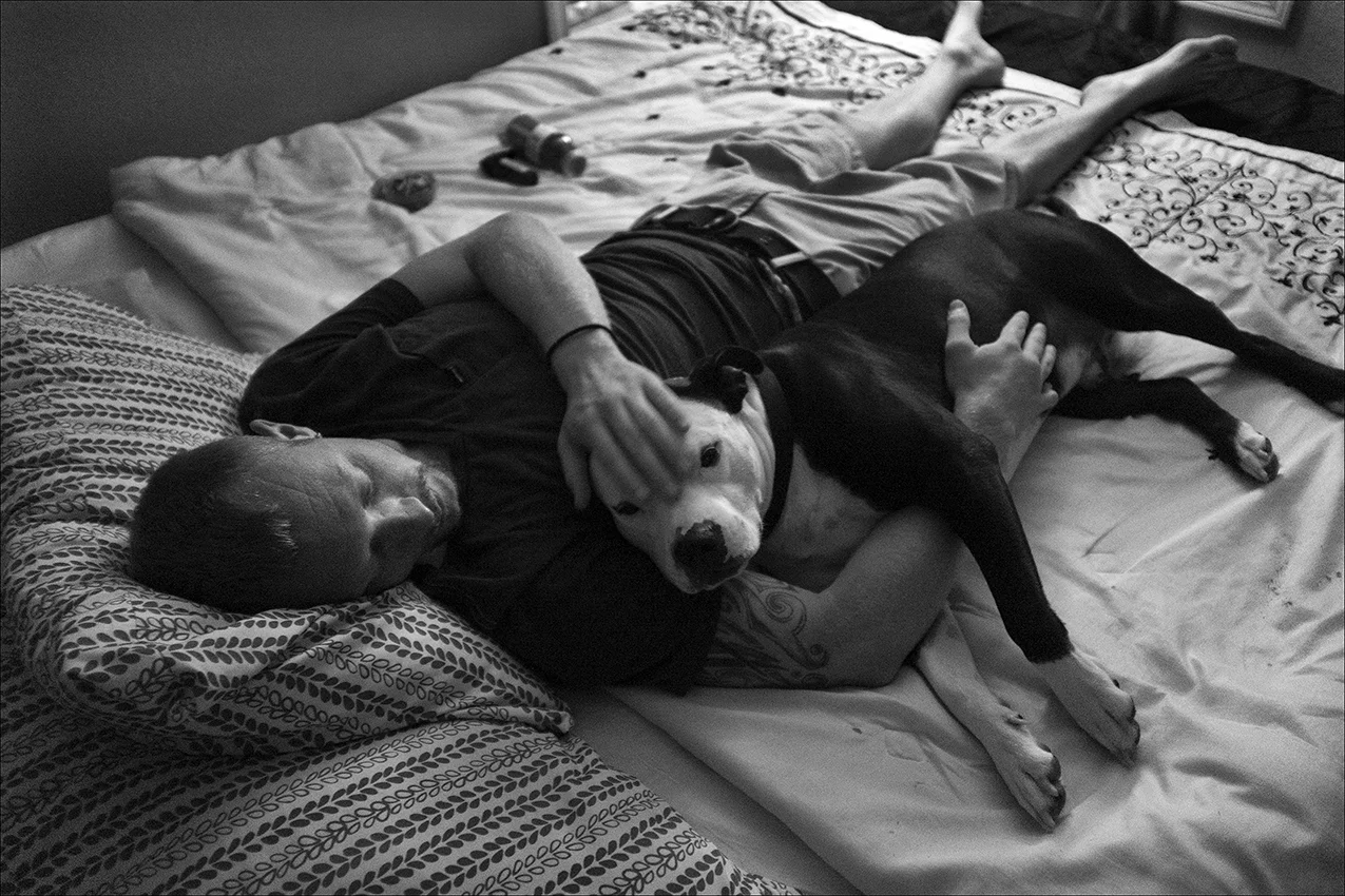August 2017: Sean, 28, rests with his dog, Zeus, where he shares an apartment with a couple living in poverty, who took him in. Sean found the dog in a dope house where he says Zeus was being beaten. An untrained companion dog, Sean says Zeus can detect when he’s about to have a blackout. “Blacking out is the worst. It can happen anywhere. It’s almost like I can watch but I have no control over what I’m doing. It’s like a sudden aggressive, mean, hateful personality that can arise if someone yells at you, for no reason or something like that. One little nip to my leg to get my attention - it’s his way of saying, stop. He’s pulled me out of situations that could have been detrimental to me and others.” Sean says his dog means everything to him. “Like when you feel there's no purpose for you on this planet anymore, that will eat your soul alive. That would be the reason you commit suicide. When you don't feel like you'd do anybody any good. If it wasn’t for my dog, I would have pulled the plug a long time ago, but I couldn’t do that to him, he’s always been there for me. Despite how cruel you can be, he’s gonna love you with all his heart, and that’s the bit of hope I need. Zeus is a loving dog. He has love in his soul. Even when things are crappy and you’re sleeping on the streets, he gonna sleep right next to you, and he’s not miserable. He’s just happy you’re there with him.”