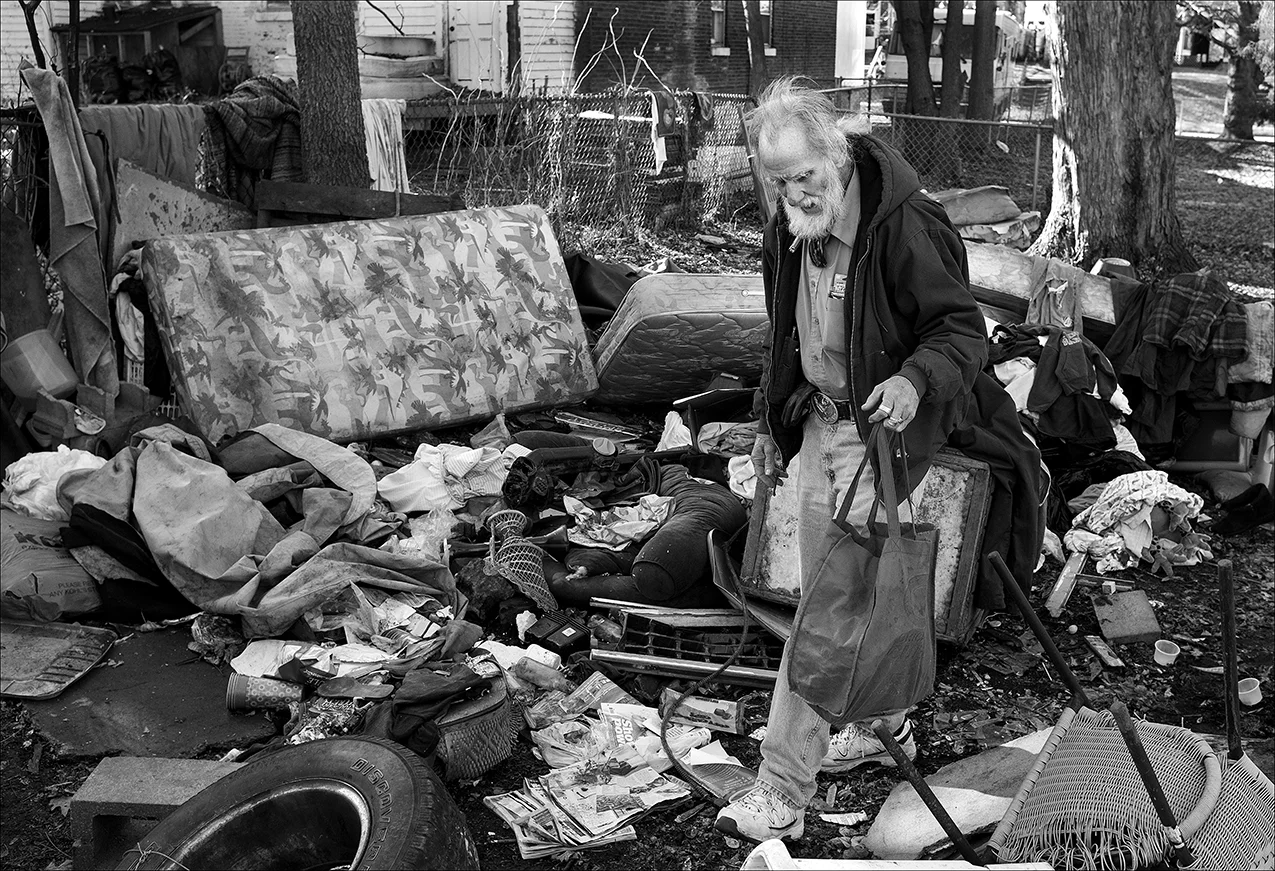 January 2018: Walter stayed away from the rental house for about a month because of what he said were threats made by the landlady’s son. Walter returned in January to find the shelter torn down and Walter’s belongings trashed. His clothes are wet and mildewed. His small collection of art supplies is ground into the mud with much of his other person property. After confrontations with the son and a stay in the Veterans Hospital in Iowa City, Iowa, Walter is able to return to the rental house but it still does not have heat or electricity. Walter said he applied for public house but was told there was a two- to three-month waiting period. Walter says he can’t find a place he can afford on his $681 monthly Social Security retirement check.