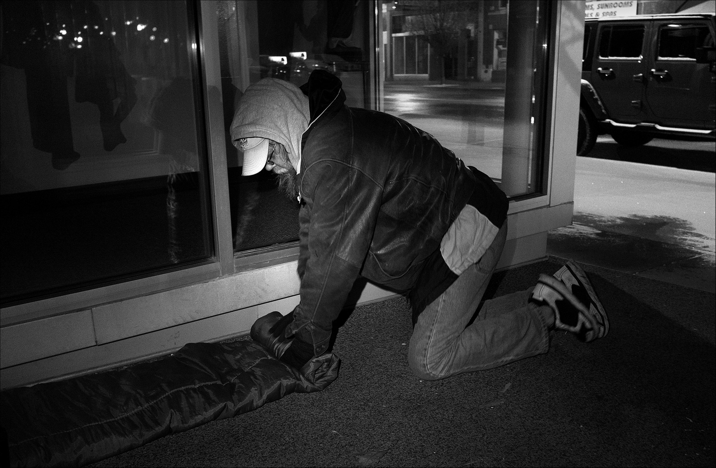 March 2017: Rising early on a freezing morning to avoid any possible complains, Wes rolls up his sleeping bag where he often sleeps on Maine Street in Quincy. “The first night I was actually homeless, I’m sitting here carrying around, at the time, everything I own, which is about three big black trash bags. And I'm sitting here going, oh my God. I'm actually gonna have to sleep out without a tent, without a sleeping bag. How in the hell am I going to do this? I ran onto a dude and he and I talked a little bit, and we kinda got along. This is the middle of February, it turned out cold that night and he and I were like, I mean, you talk about a couple of dudes not wanting to, but then yet still, I mean, if we hadn't snuggled up to each other we probably be both dead. I mean it got below freezing that night.”