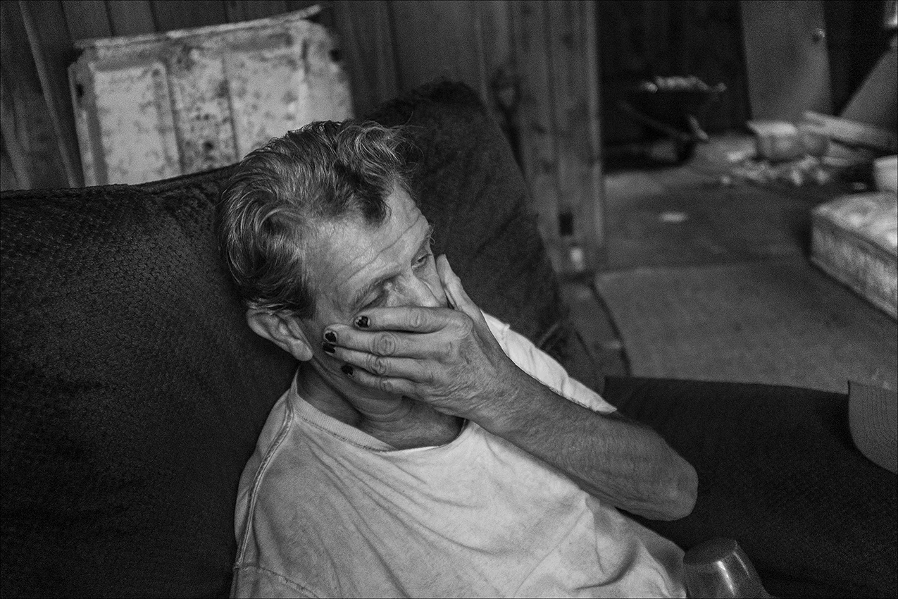 SEPTEMBER 2018: James rests in a chair where he is living in an abandoned house in Quincy. He is undecided as to whether or not to move to a warmer year round climate before winter.