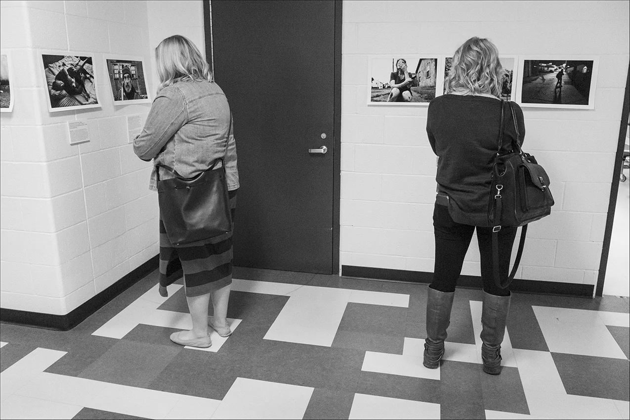 About 2,200 area educators attended the Quincy Conference at the Quincy Senior High School in Quincy, Illinois last week where the Quincy Illinois Poverty Project exhibit was on display. The exhibit consisting of about 100 photographs, spanning the stories of 25 individuals and families, is designed to help raise awareness about homelessness and poverty issues in Quincy.