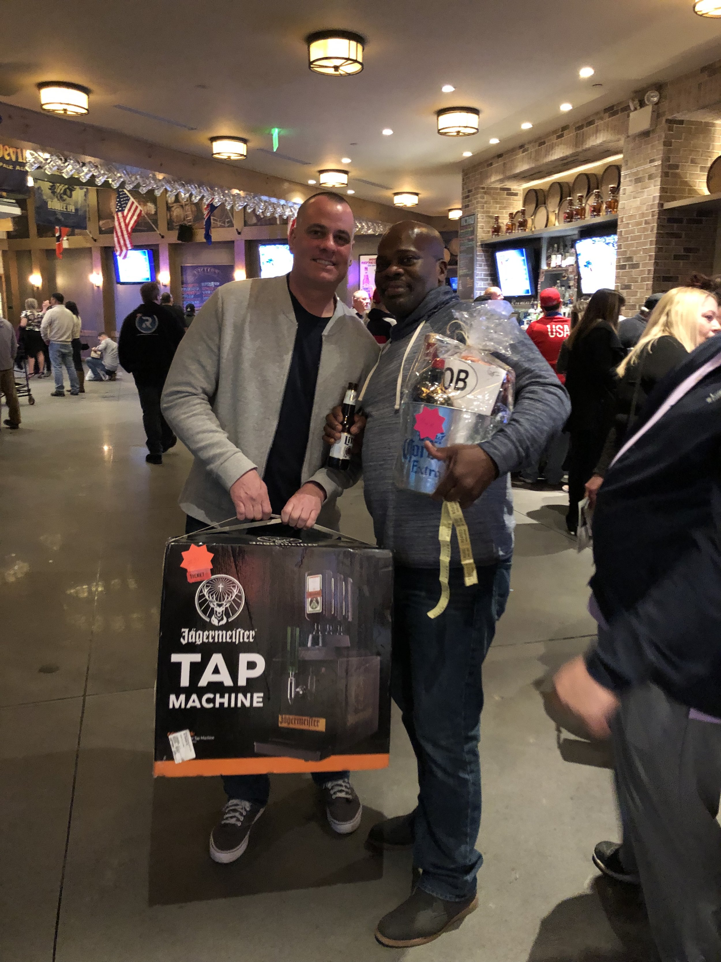  Liquor basket winner Donovan with double winner Jerry Malone who also took home a Jagermeister tap machine. 