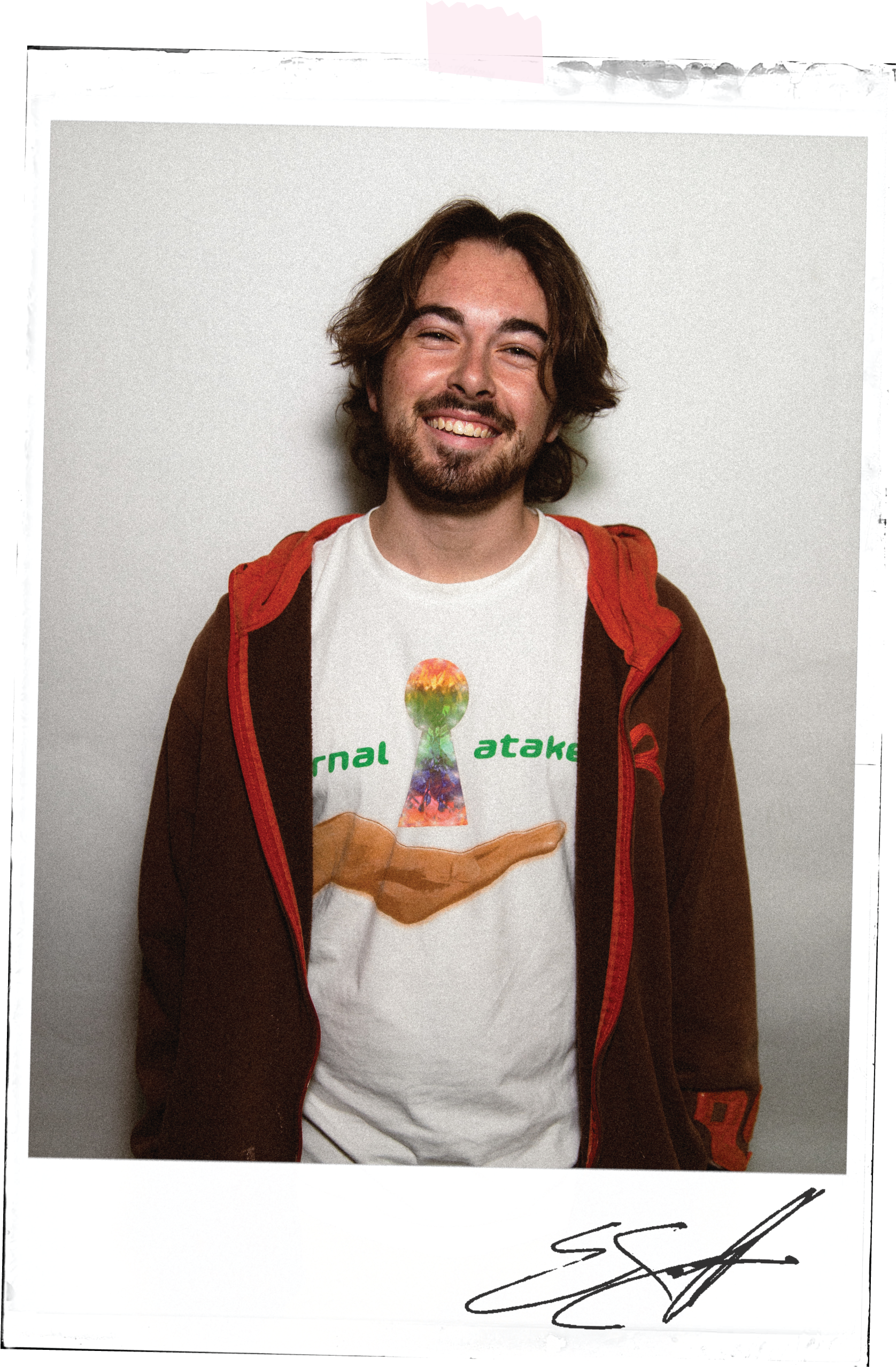 Ethan's poloroid portrait taped to the background with her signature underneath