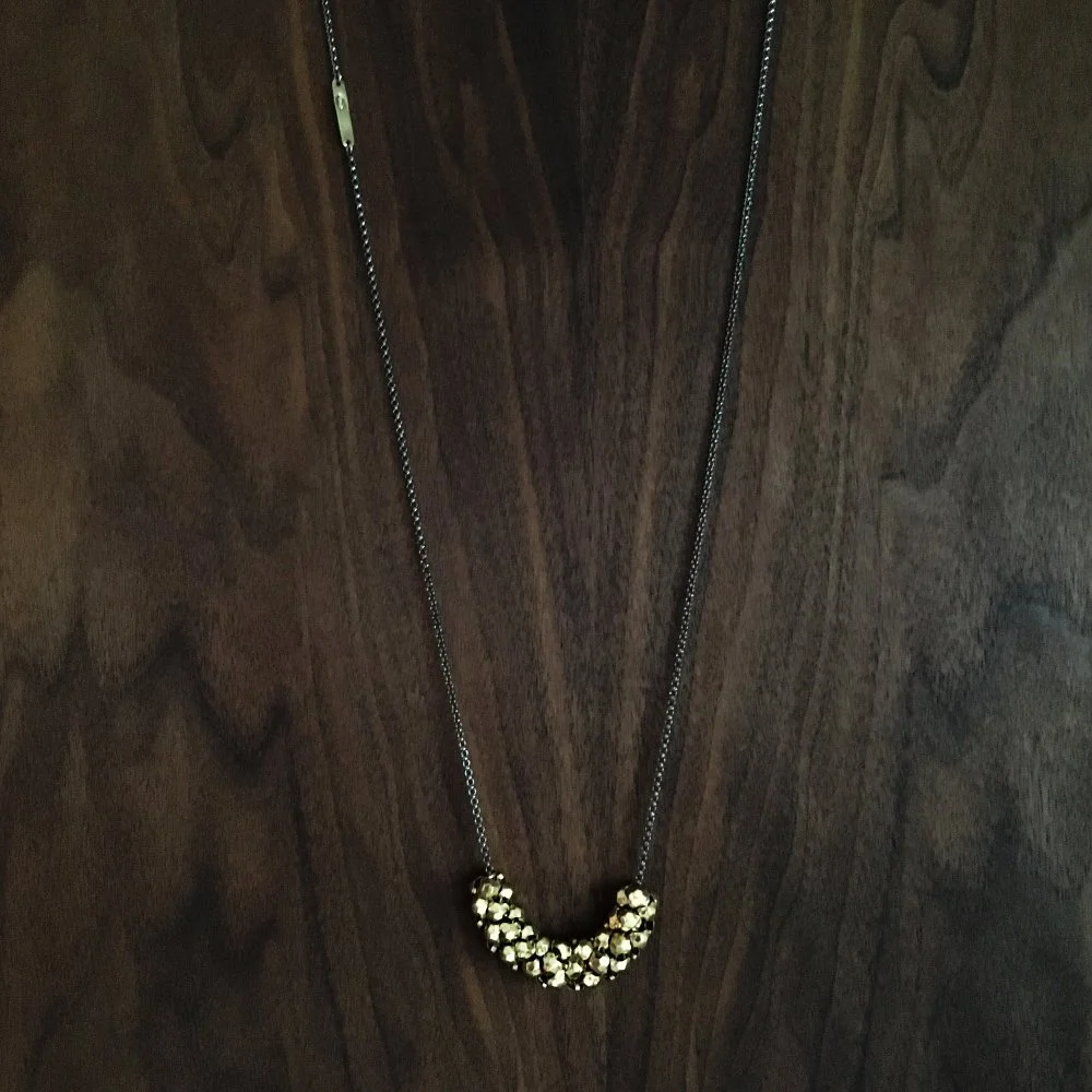 Stud Mesh Roller Necklace, on walnut | oxidized sterling silver with reclaimed vintage gold metal mesh elements. Handmade by Maral Rapp | www.maralrapp.com