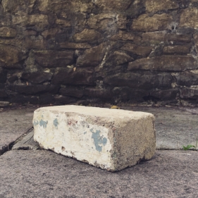 A brick from the former Huwood building in Cardiff, 2016