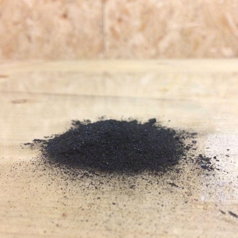  Black ash from the Spit and Sawdust fire pit. This was ground up and made into an egg tempera paint which I used to create the final  wall mural . 