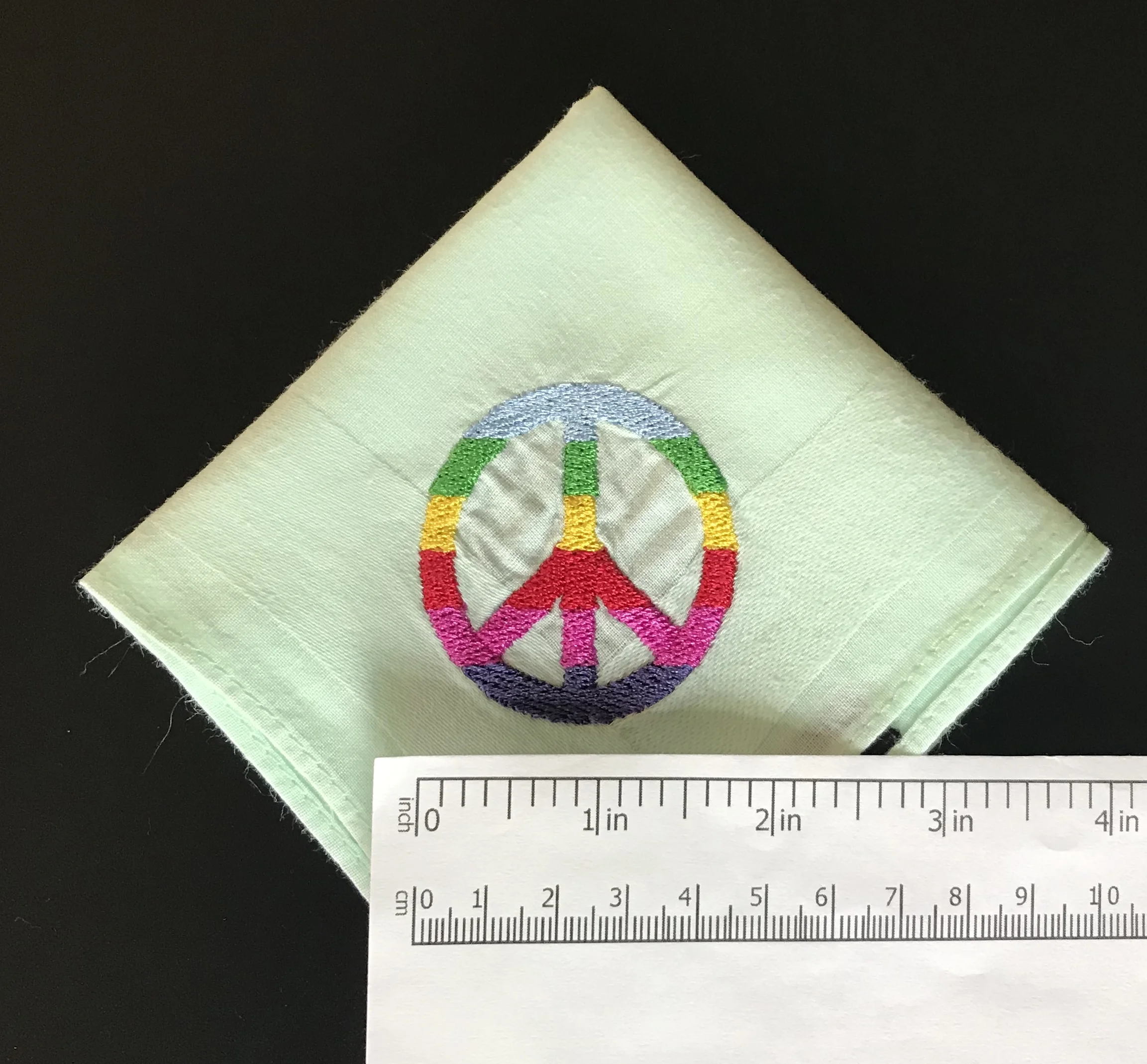 Peace CND mens mint quarter with ruler.jpg