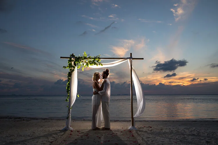 Beach wedding couple at sunset, by Susan Pacek Photography.